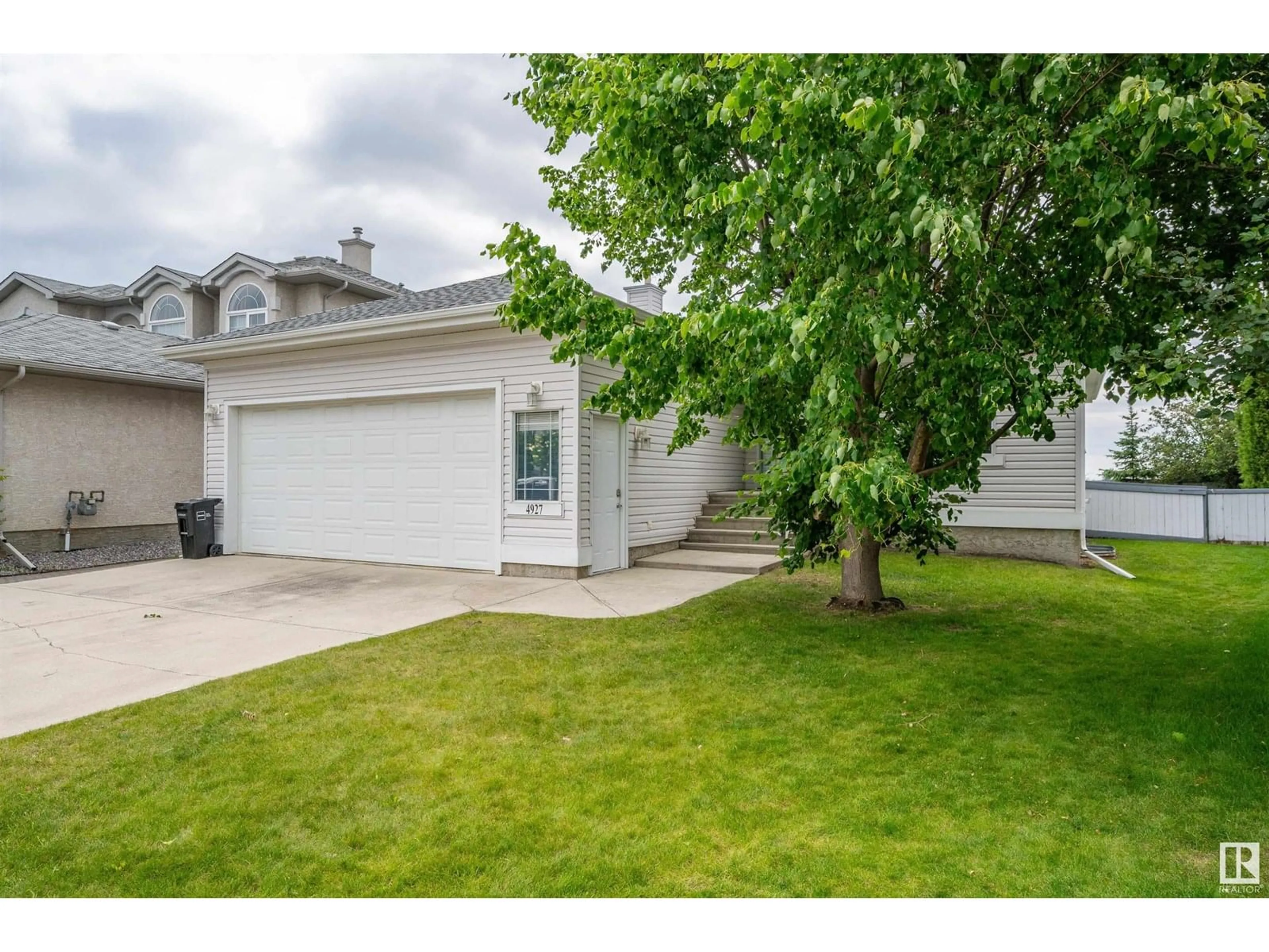 Home with vinyl exterior material, street for 4927 152 AV, Edmonton Alberta T5Y3C2