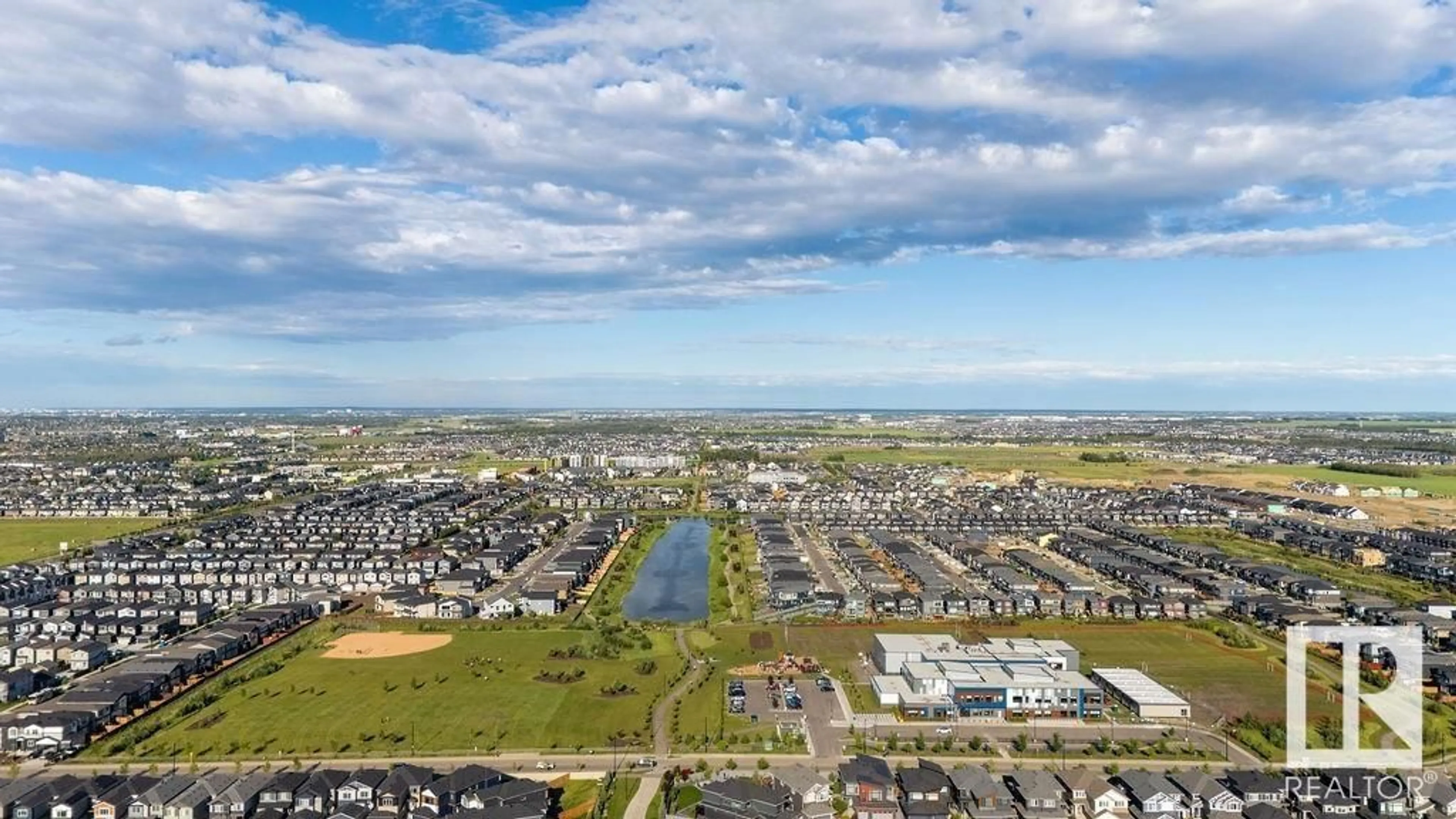 A pic from outside/outdoor area/front of a property/back of a property/a pic from drone, water/lake/river/ocean view for SW - 7047 KIVIAQ CR, Edmonton Alberta T6W5R2