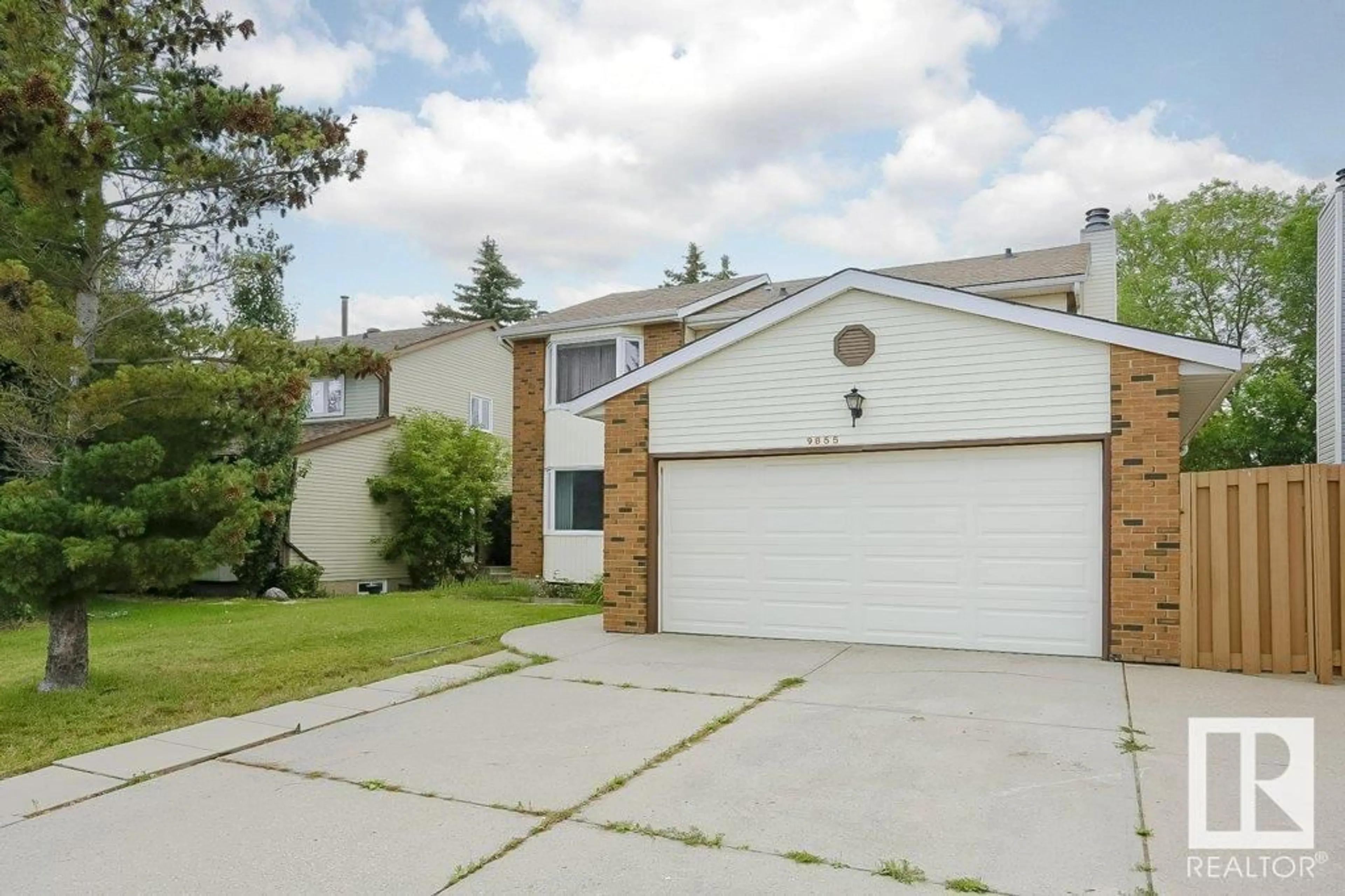 Home with vinyl exterior material, street for NW - 9855 179 ST, Edmonton Alberta T5T3P7