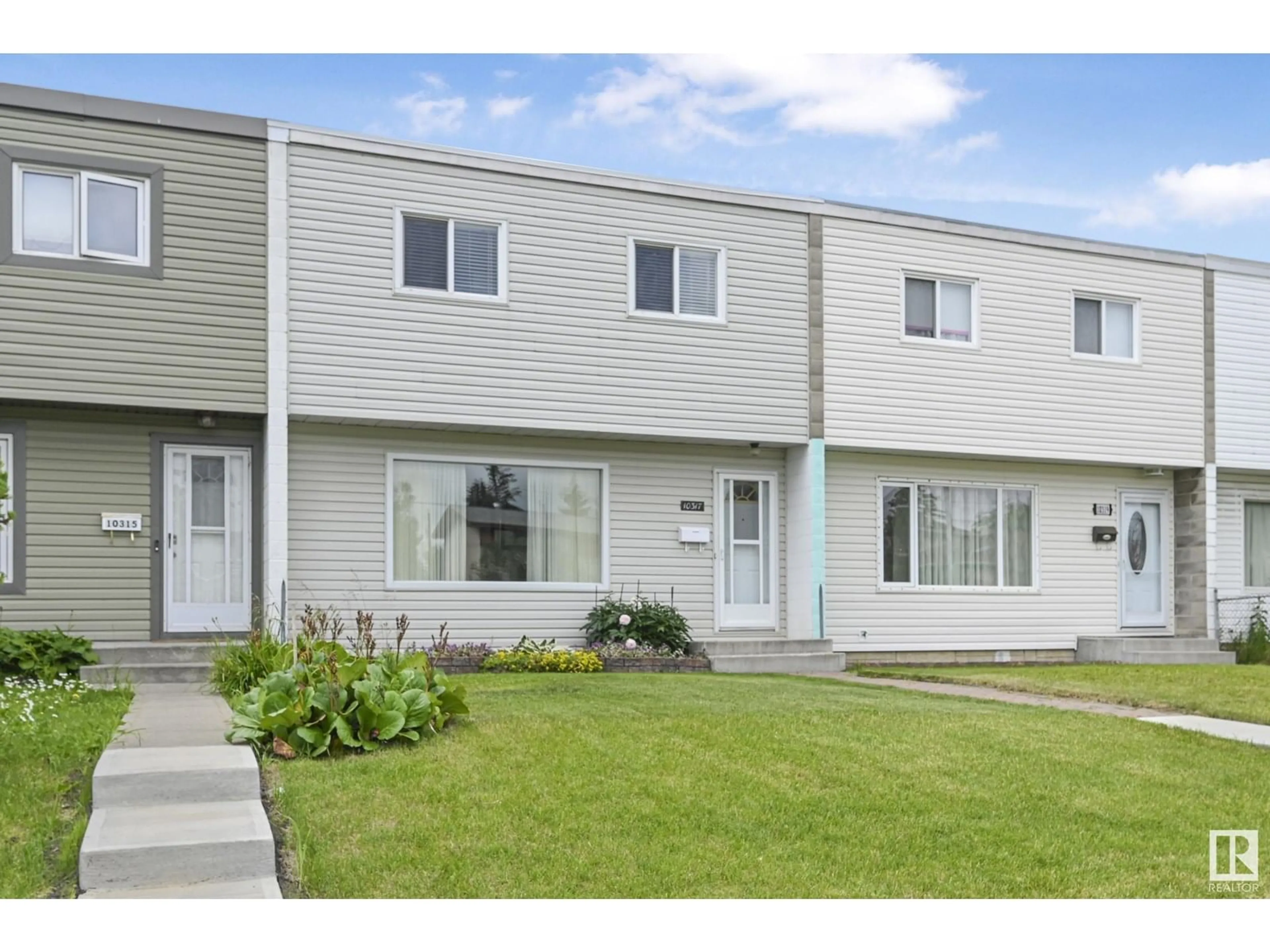 Home with vinyl exterior material, street for 10317 132 AV, Edmonton Alberta T5E0Y8