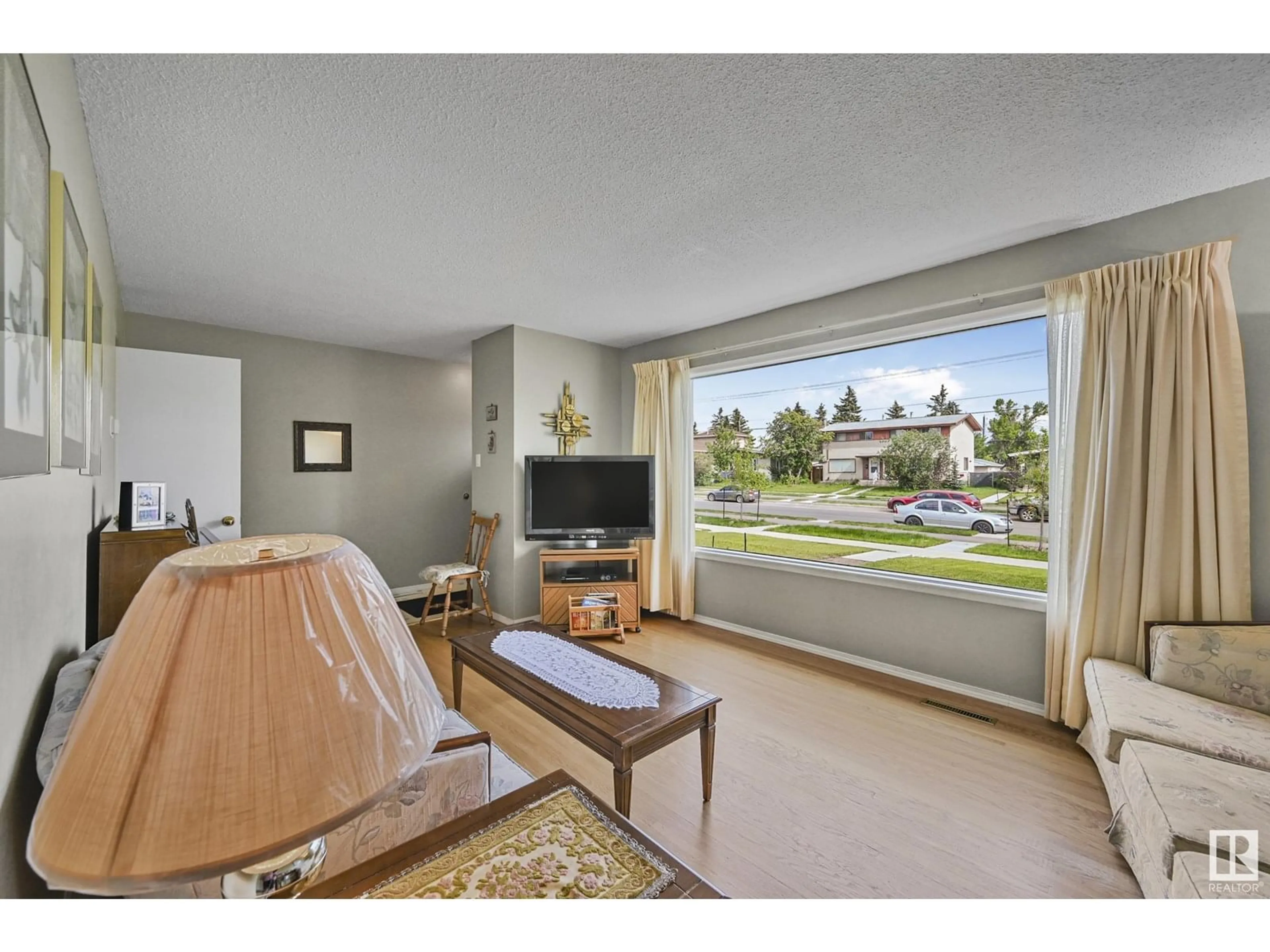 Living room with furniture, unknown for 10317 132 AV, Edmonton Alberta T5E0Y8