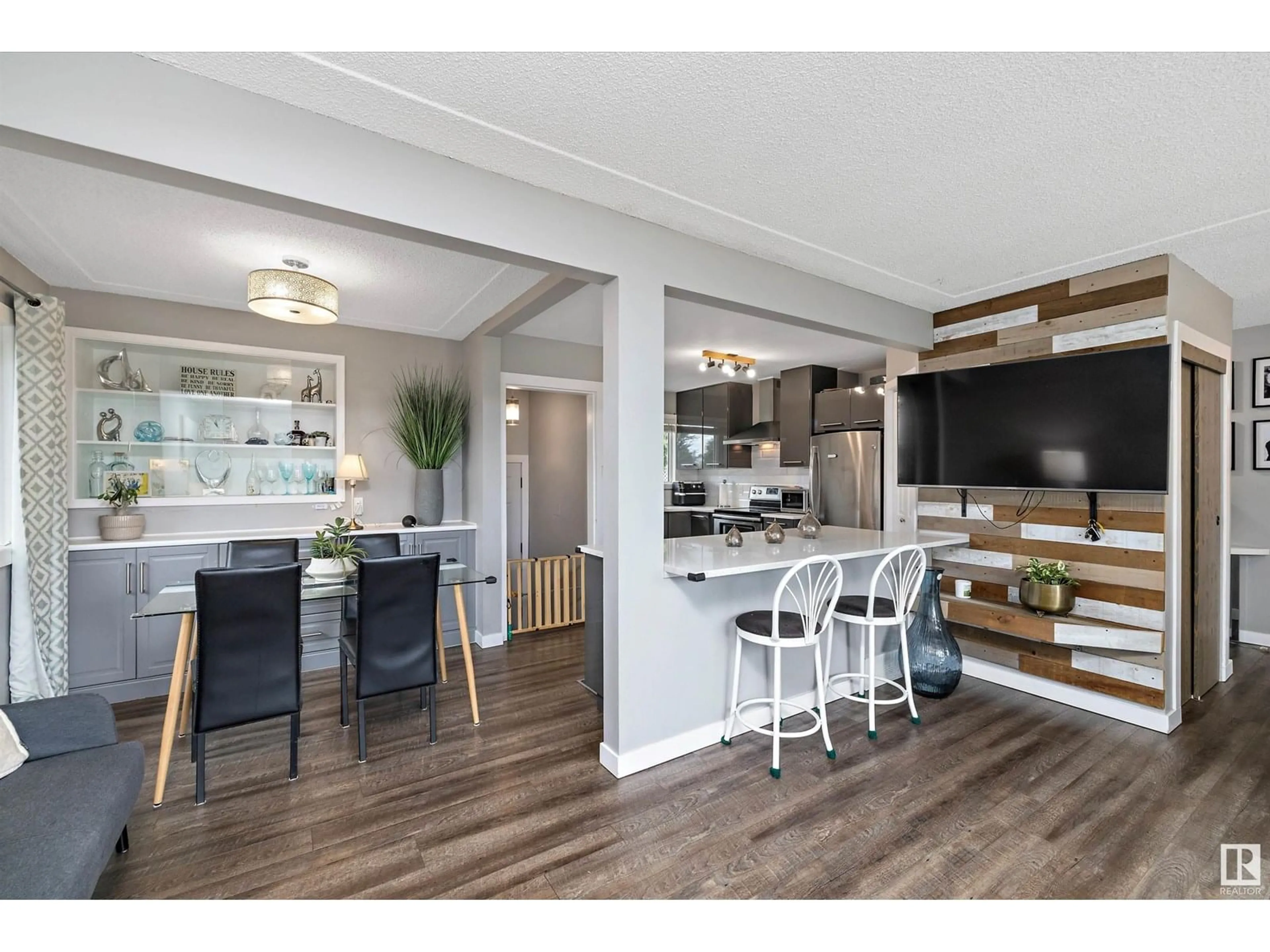 Open concept kitchen, wood/laminate floor for 9444 52 ST, Edmonton Alberta T6B1G7
