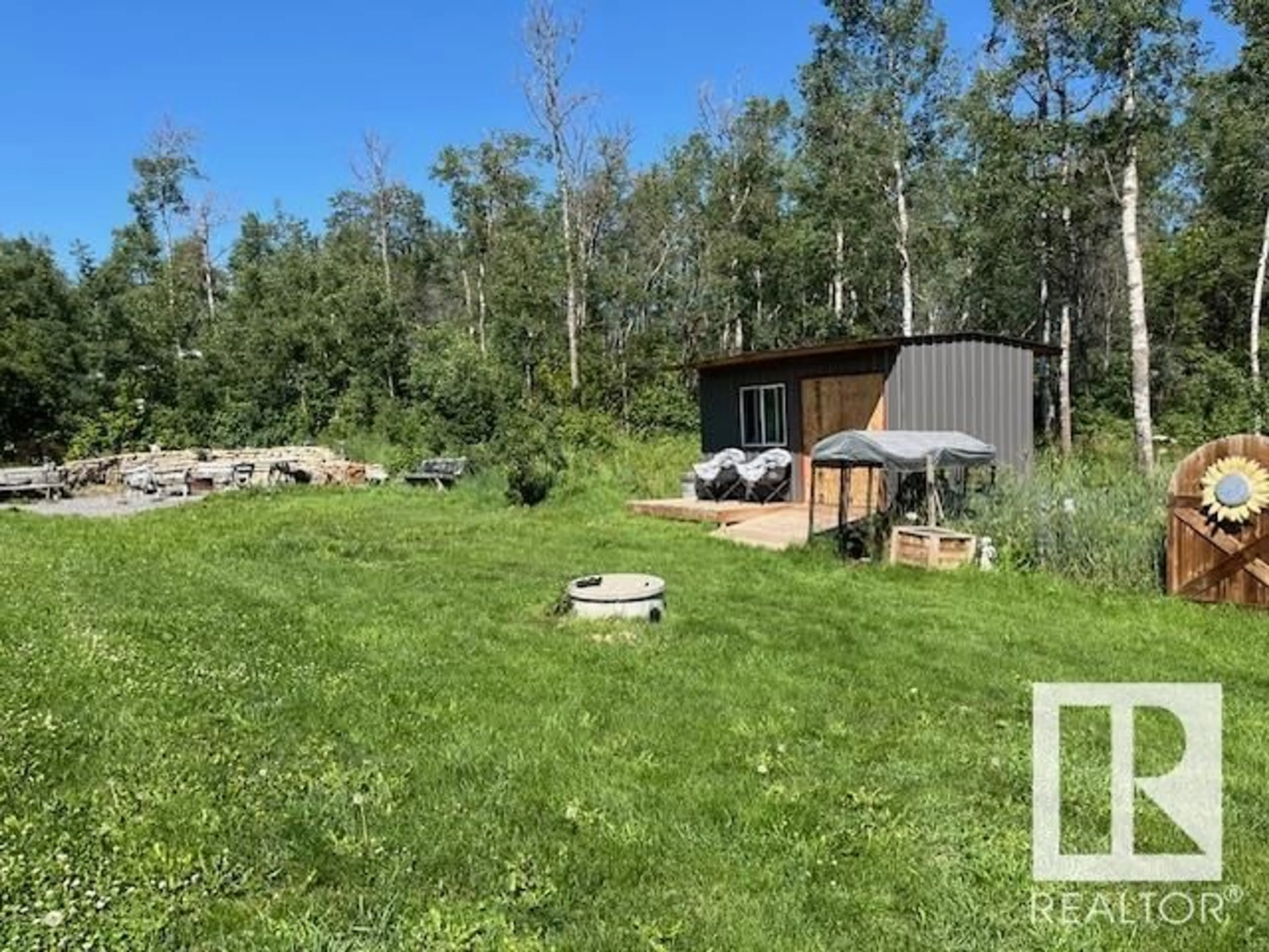 A pic from outside/outdoor area/front of a property/back of a property/a pic from drone, forest/trees view for 56023 RGE ROAD 242, Rural Sturgeon County Alberta T0A0K0