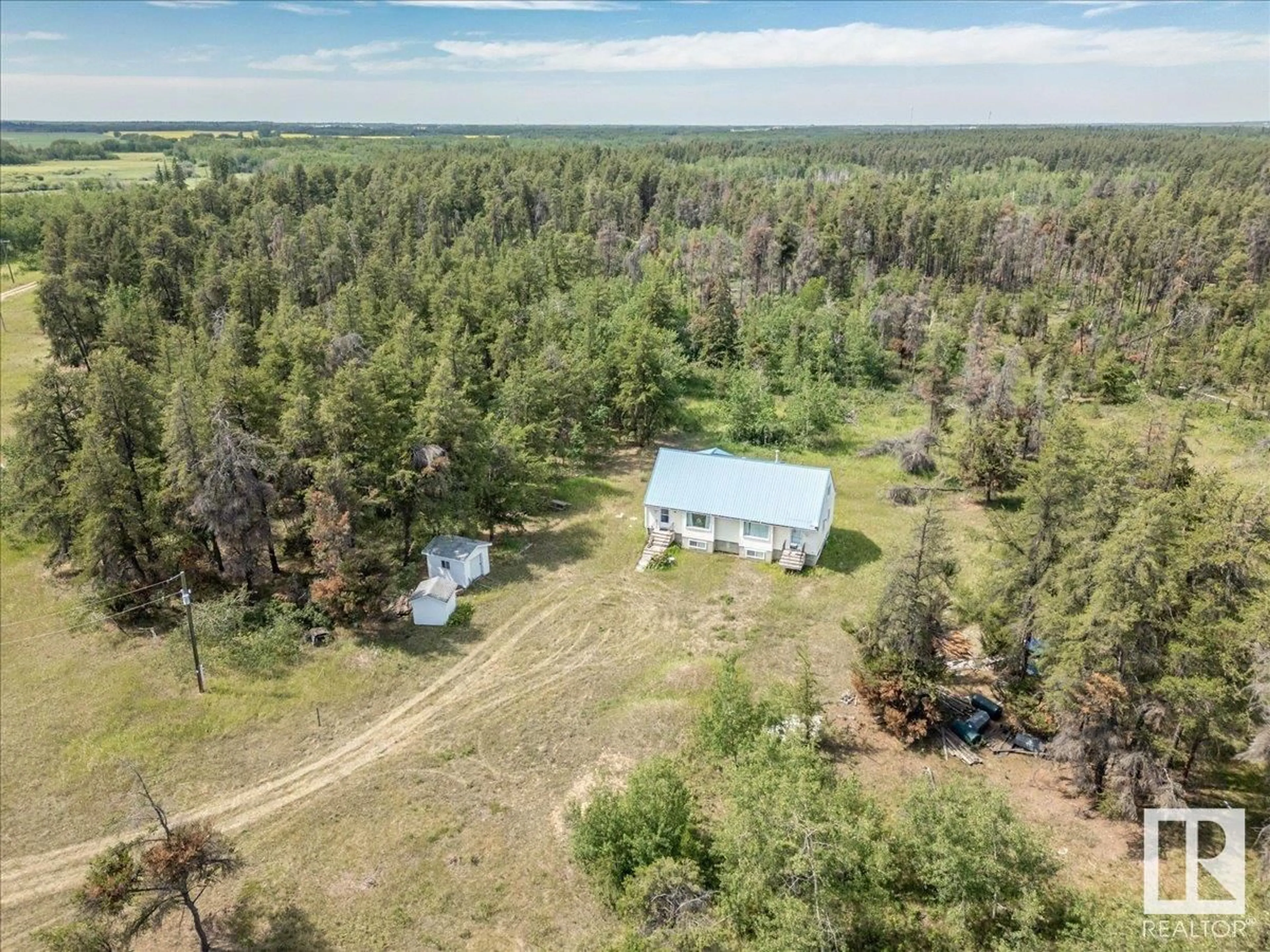 A pic from outside/outdoor area/front of a property/back of a property/a pic from drone, forest/trees view for 57021 RGE ROAD 213, Rural Sturgeon County Alberta T0A2W0
