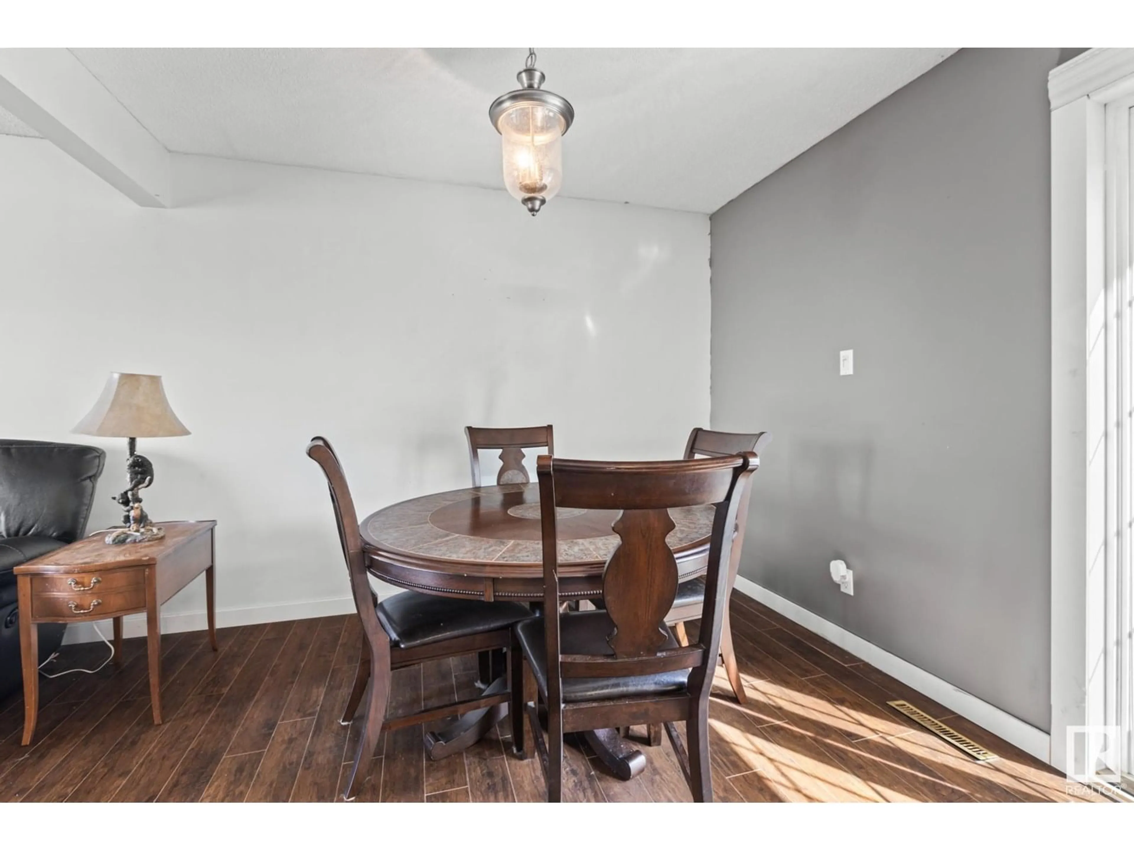 Dining room, wood/laminate floor for 7111 130A AV, Edmonton Alberta T5C1Y8