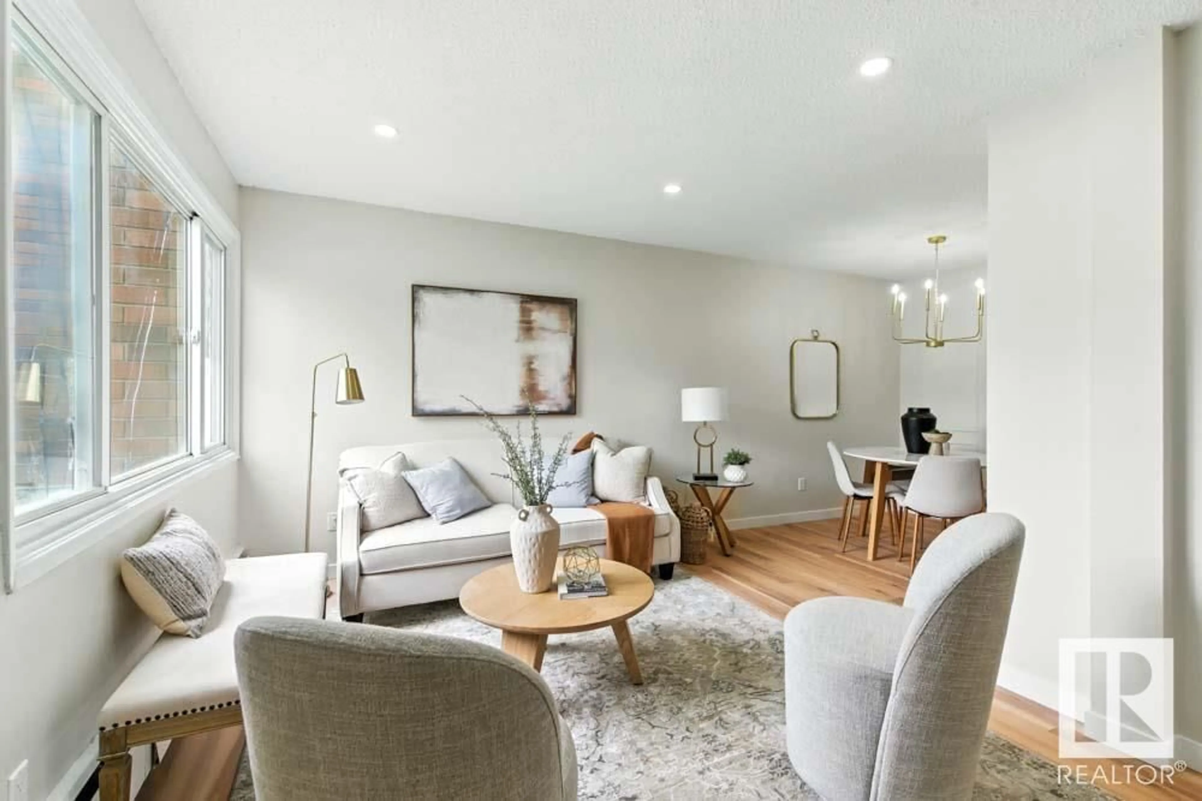 Living room with furniture, wood/laminate floor for 210 - 2908 116A AV, Edmonton Alberta T5W4R7