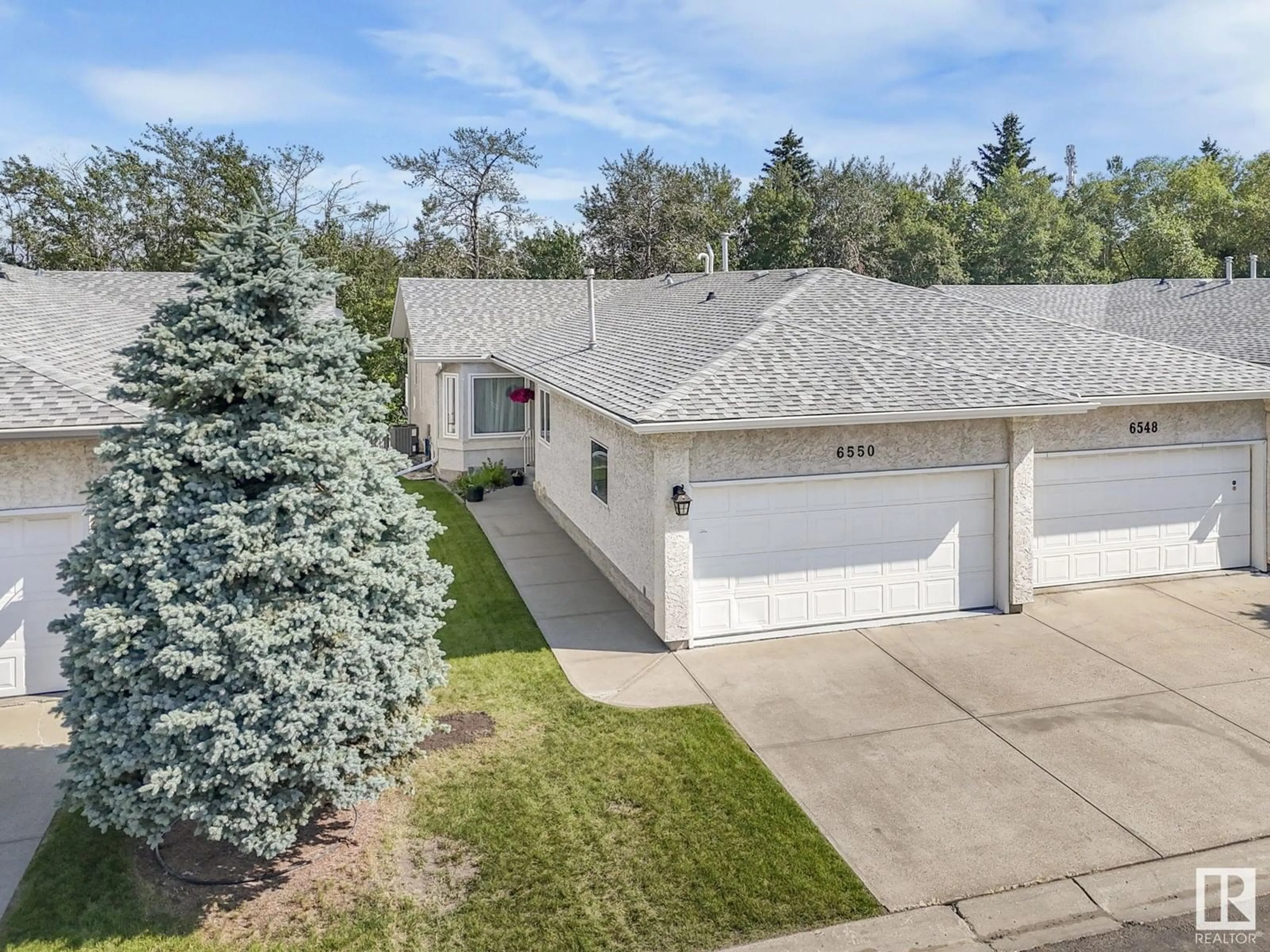 A pic from outside/outdoor area/front of a property/back of a property/a pic from drone, street for 6550 158 AV, Edmonton Alberta T5X2S7
