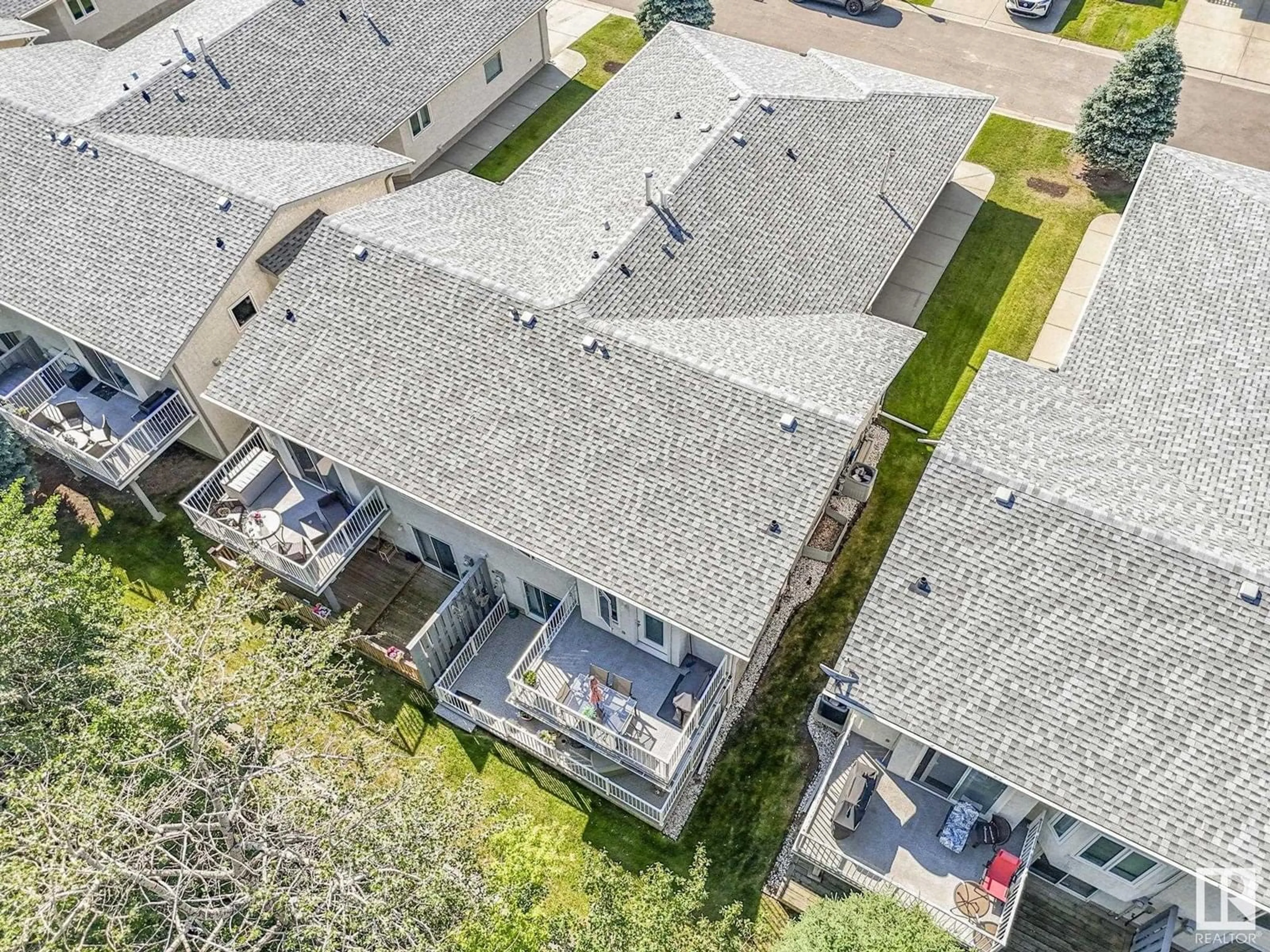 A pic from outside/outdoor area/front of a property/back of a property/a pic from drone, street for 6550 158 AV, Edmonton Alberta T5X2S7