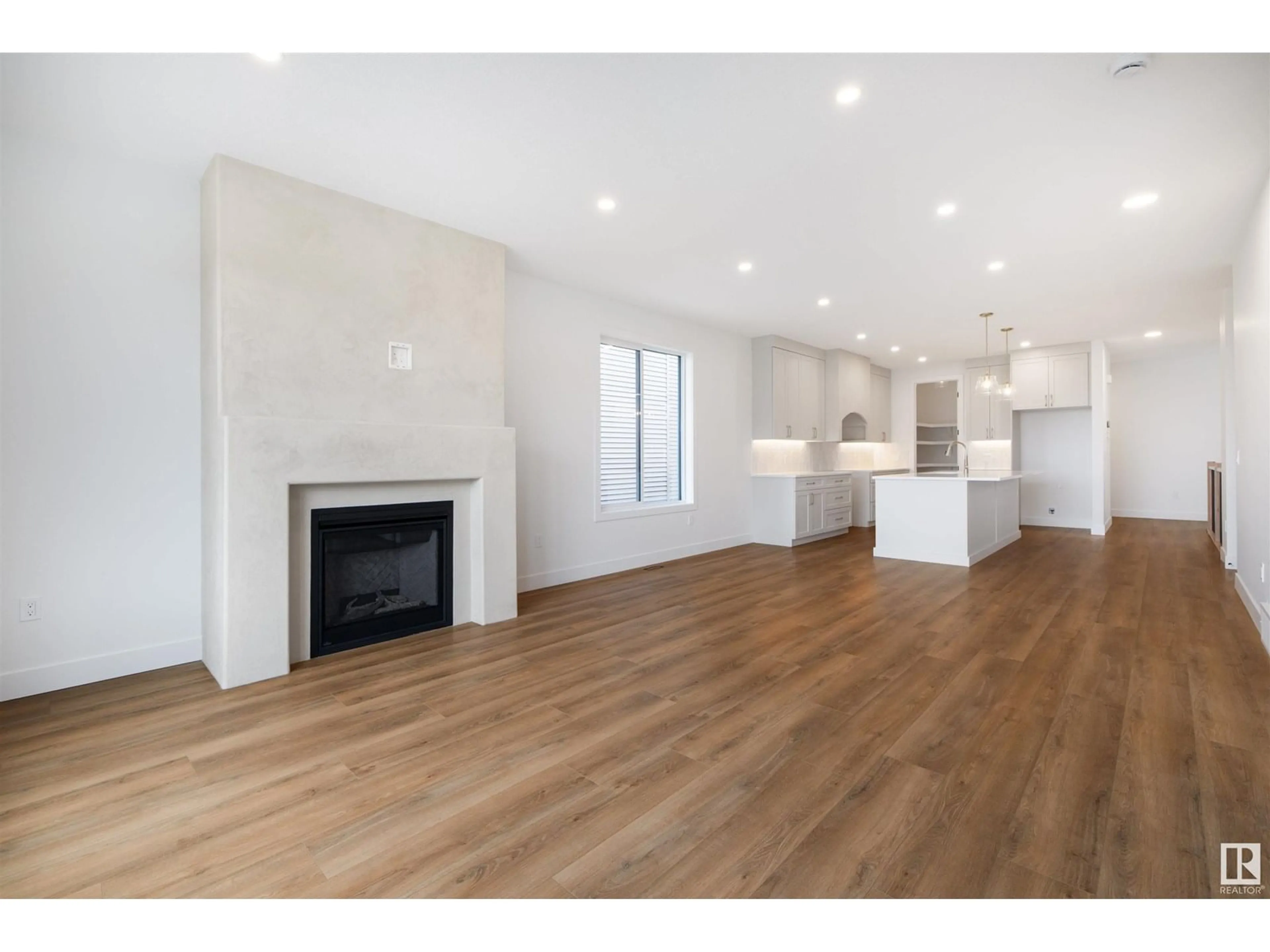 Open concept kitchen, wood/laminate floor for 3 SYDWYCK CI, Spruce Grove Alberta T7X0A0