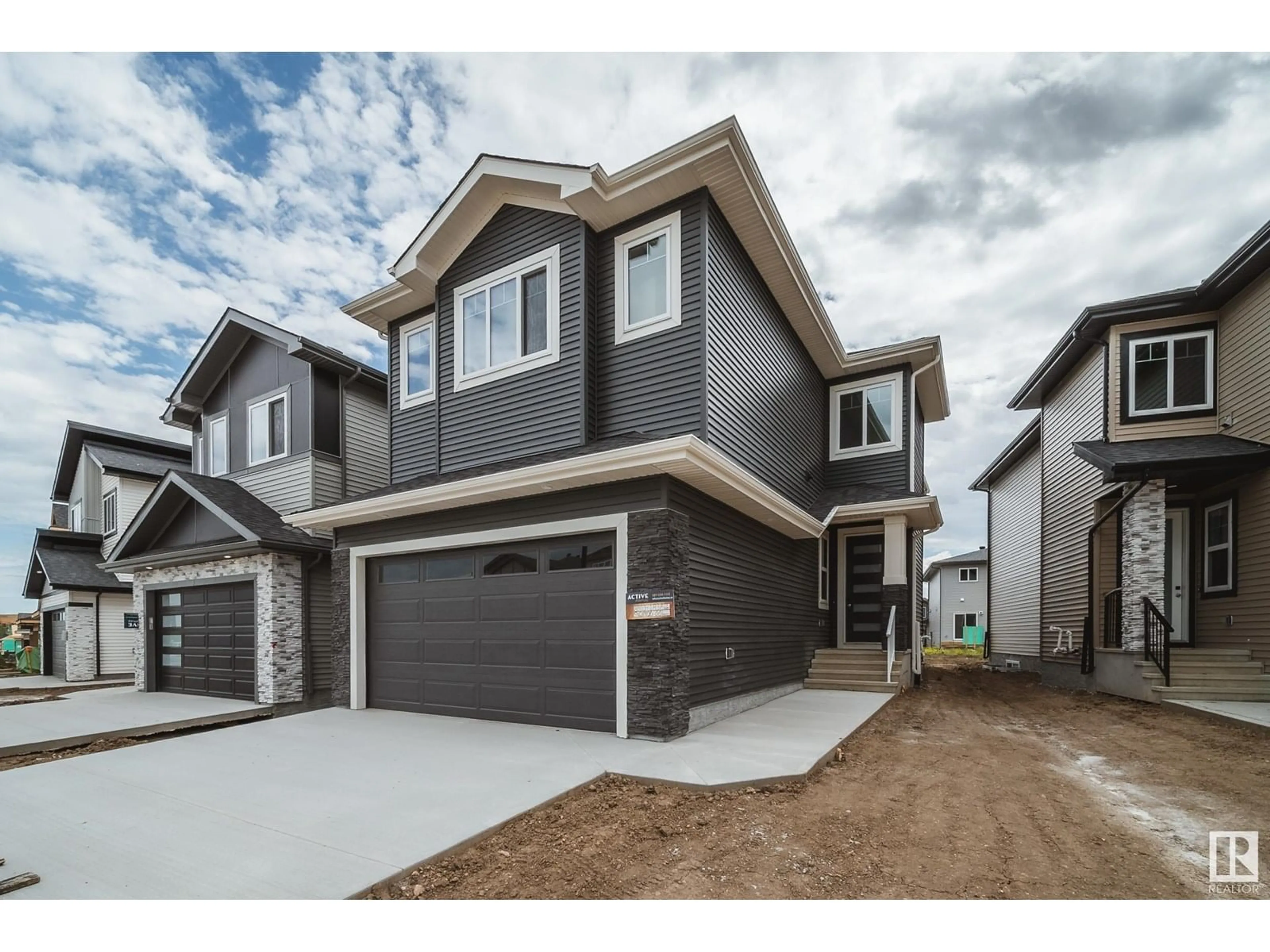 Home with vinyl exterior material, street for 8803 183 AV, Edmonton Alberta T5Z2K6