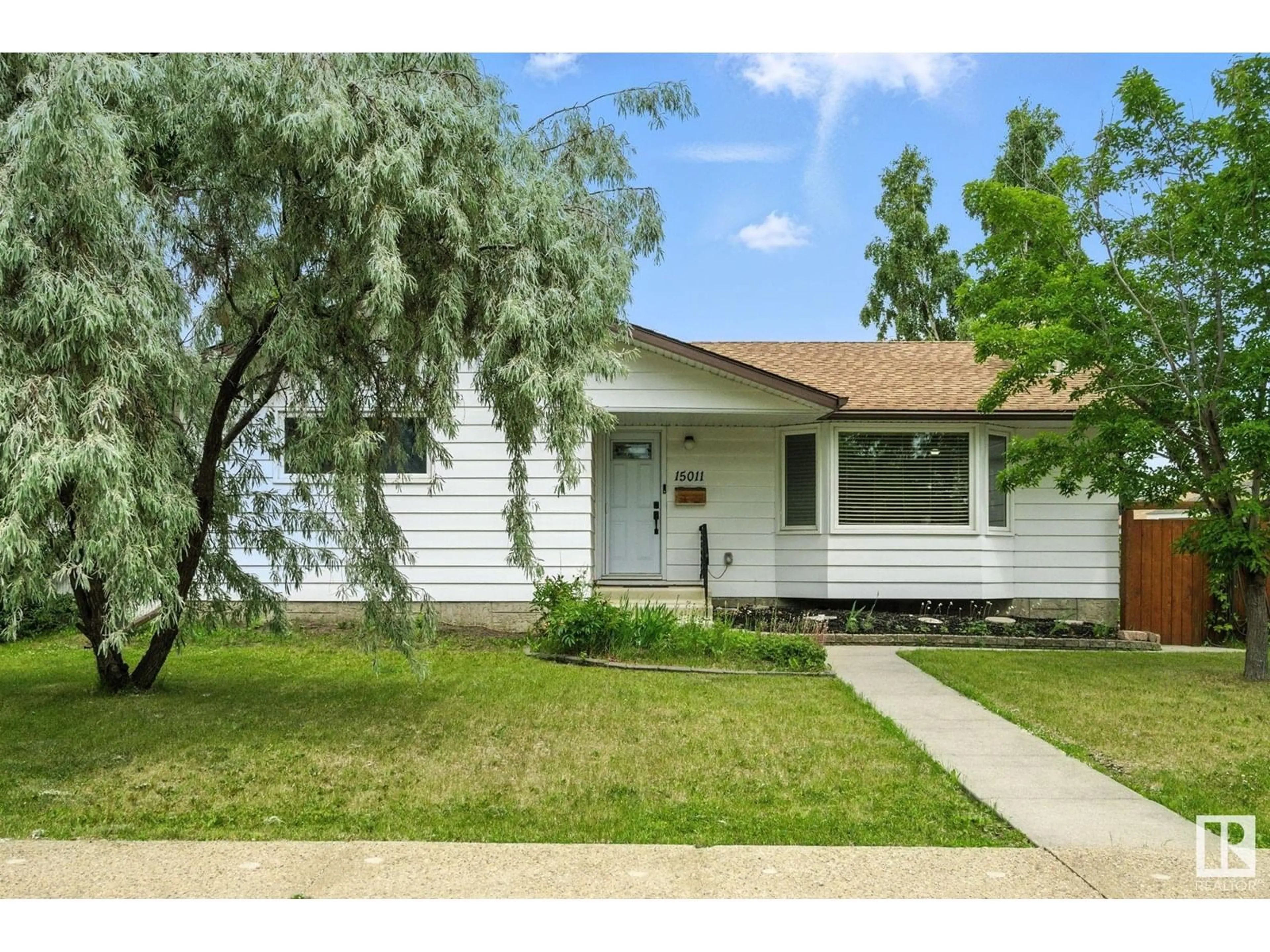 Home with vinyl exterior material, street for 15011 95 ST, Edmonton Alberta T5E3Z3
