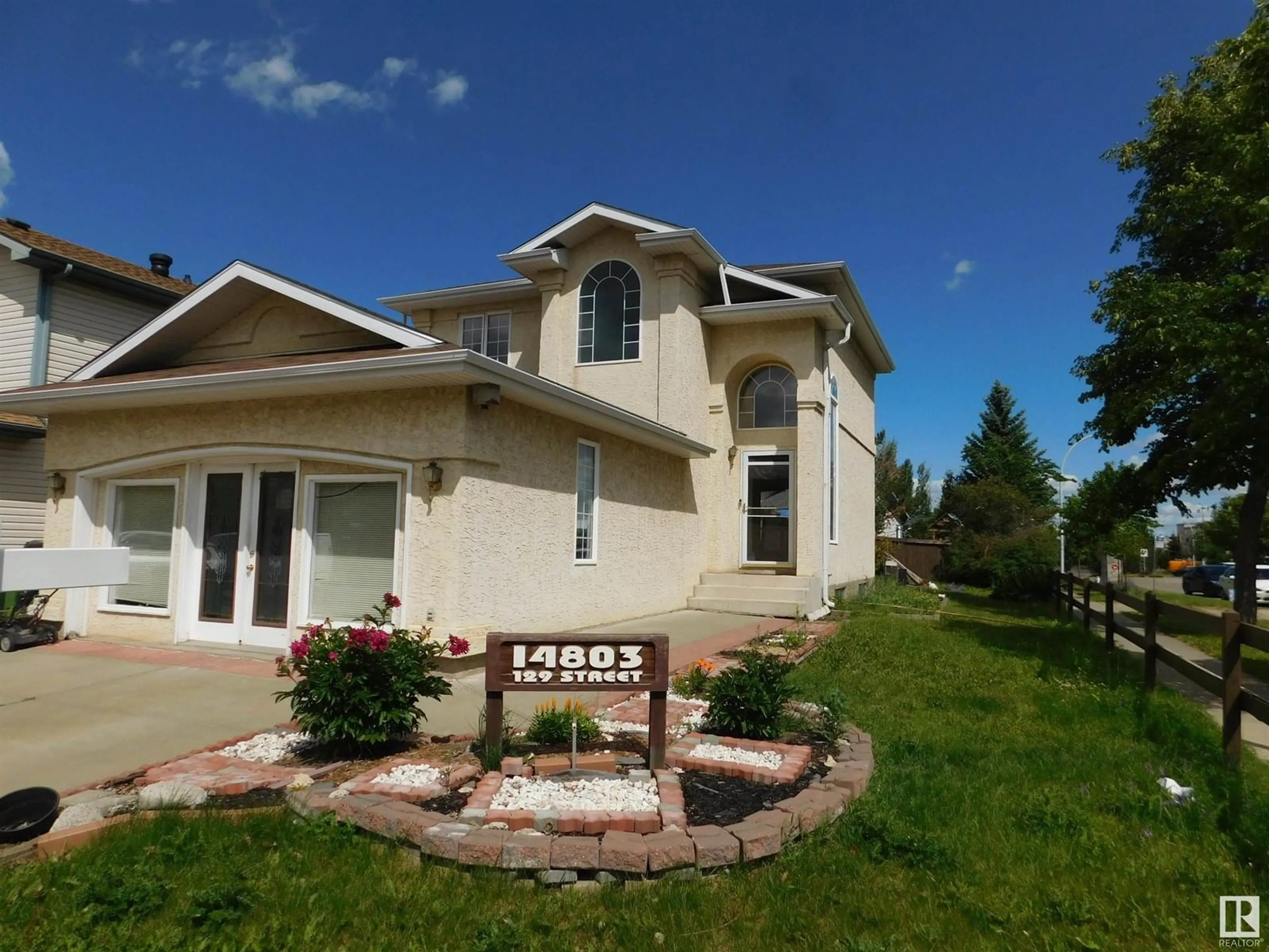 Home with vinyl exterior material, street for NW - 14803 129 ST, Edmonton Alberta T6V1C4
