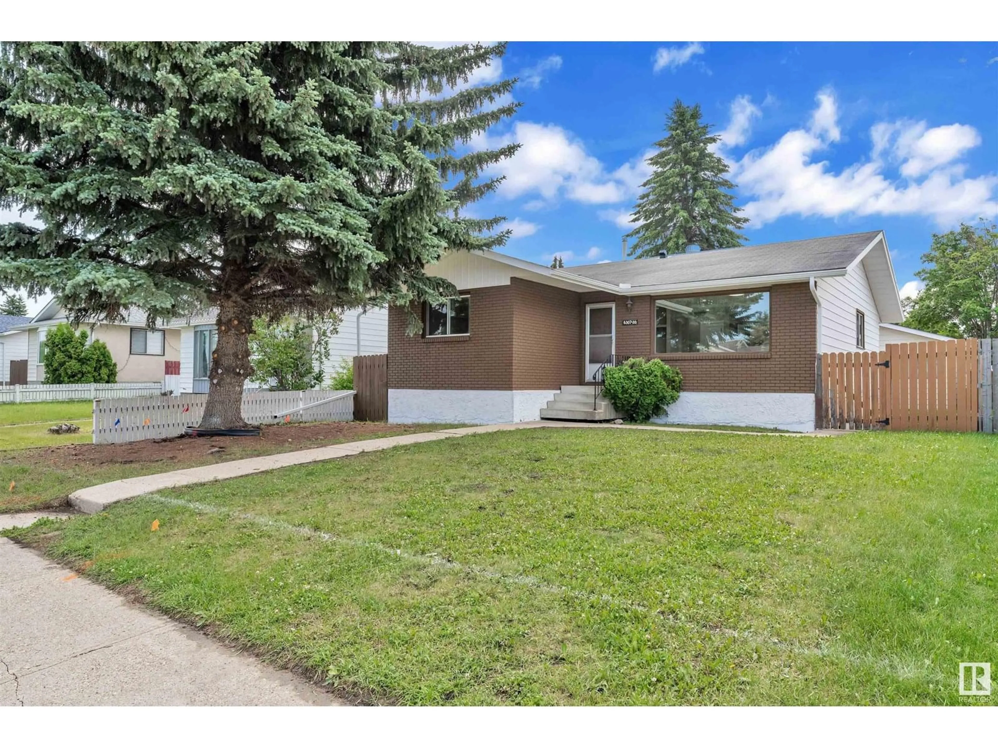 Home with vinyl exterior material, street for 6307 20 AV, Edmonton Alberta T6L1M3