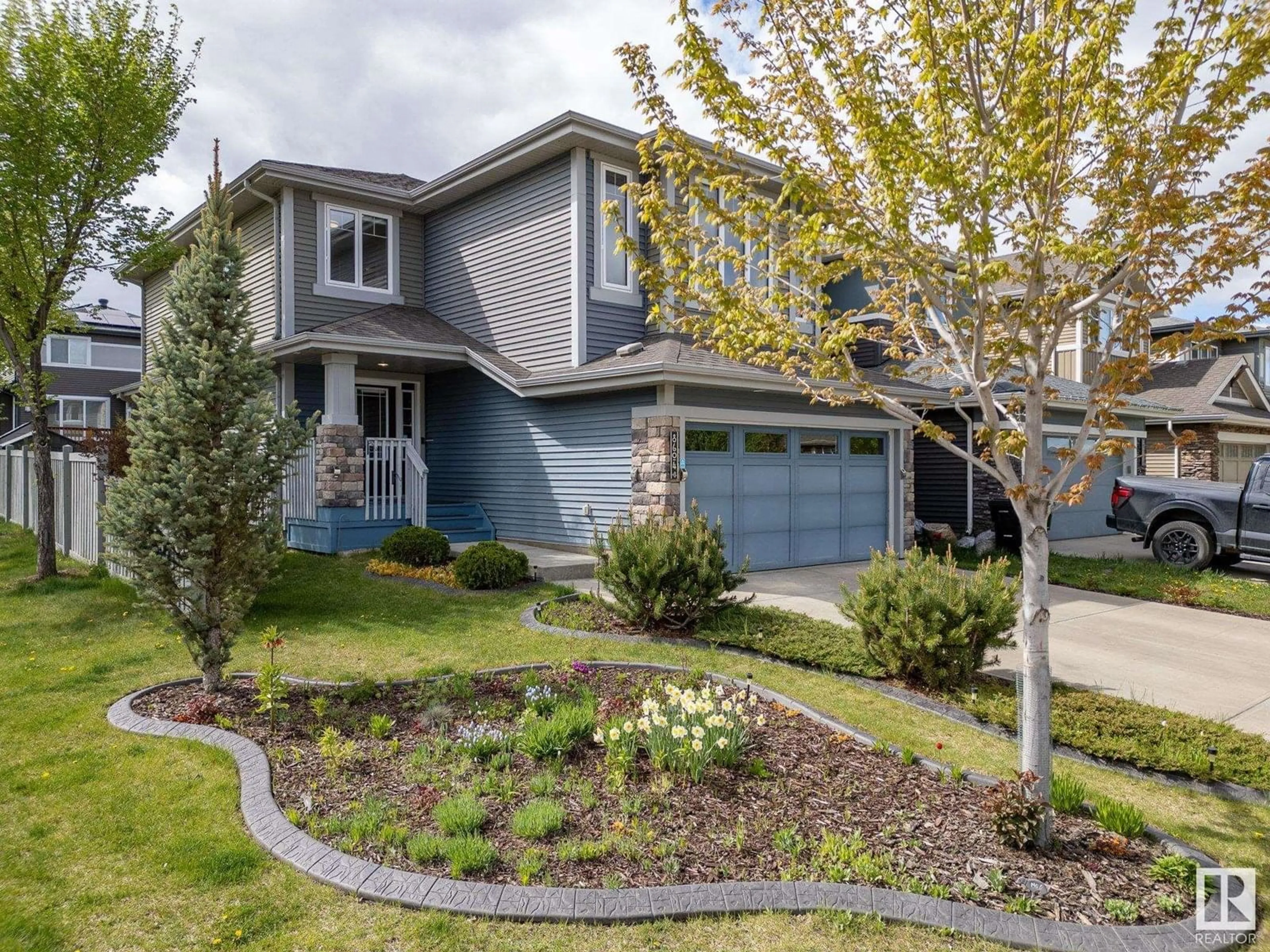 Home with vinyl exterior material, street for NW - 8604 217 ST, Edmonton Alberta T5T4R5