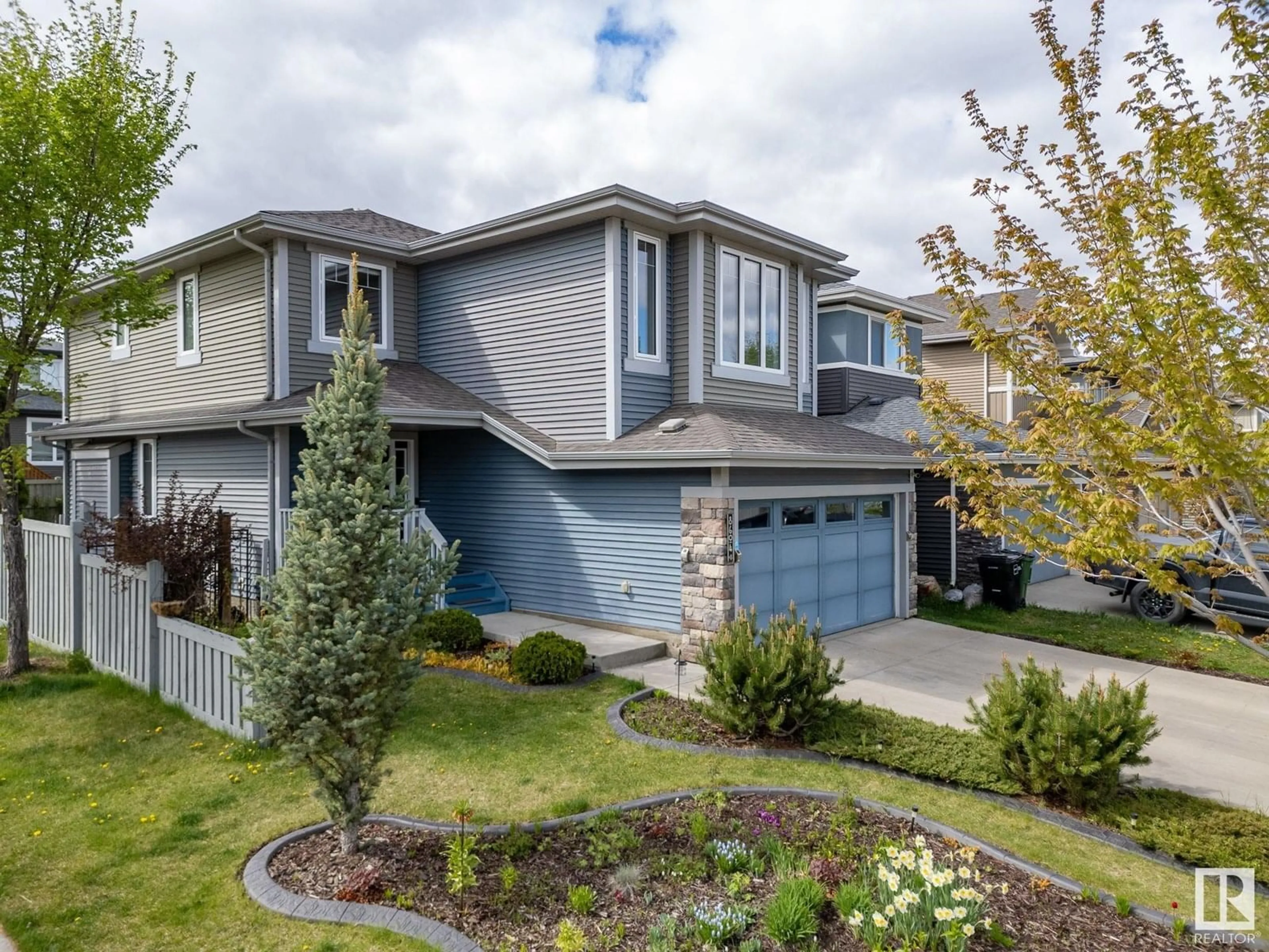Home with vinyl exterior material, street for NW - 8604 217 ST, Edmonton Alberta T5T4R5