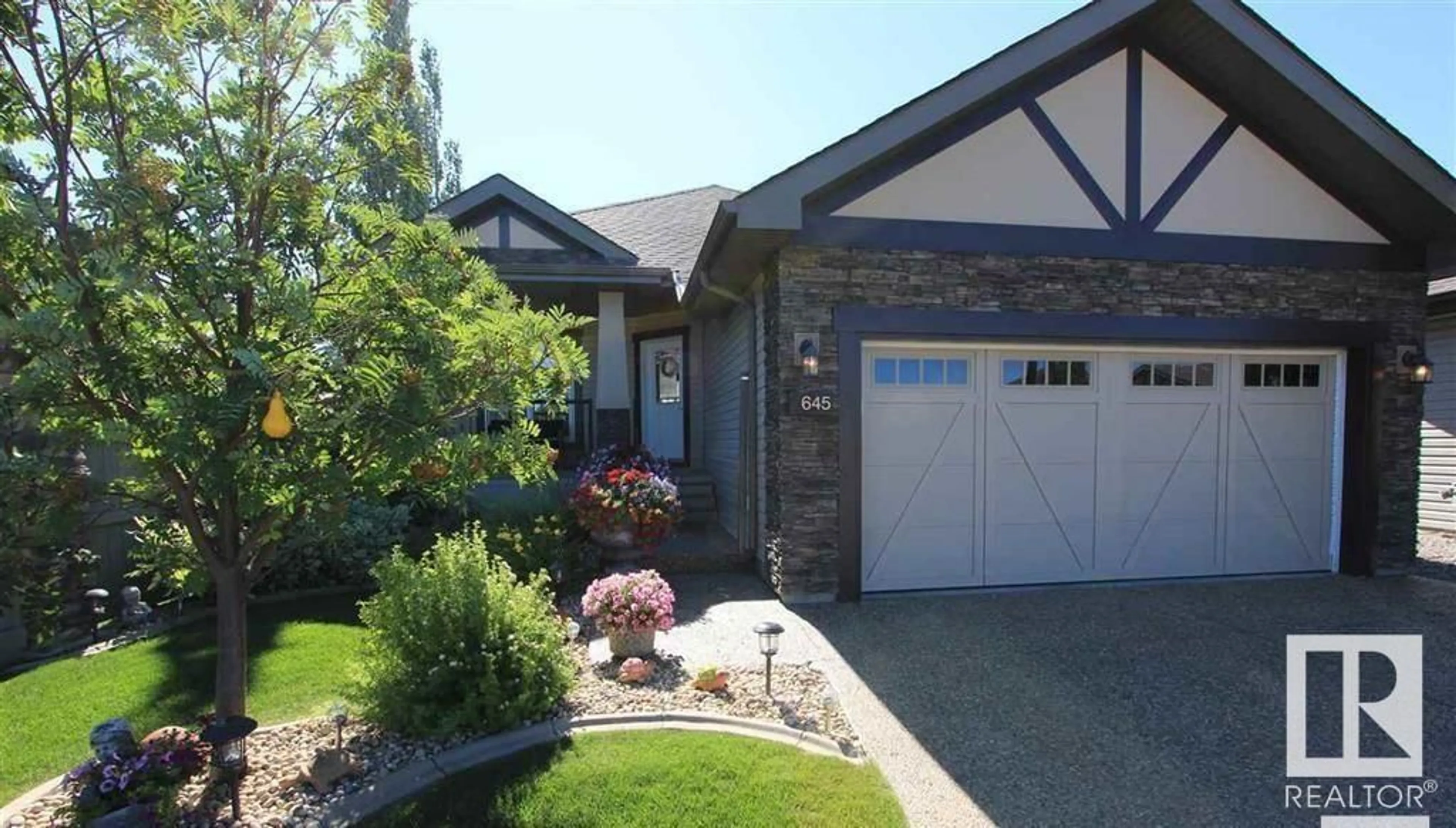 Home with brick exterior material, street for 645 CANTOR LANDING LD, Edmonton Alberta T6W0V6