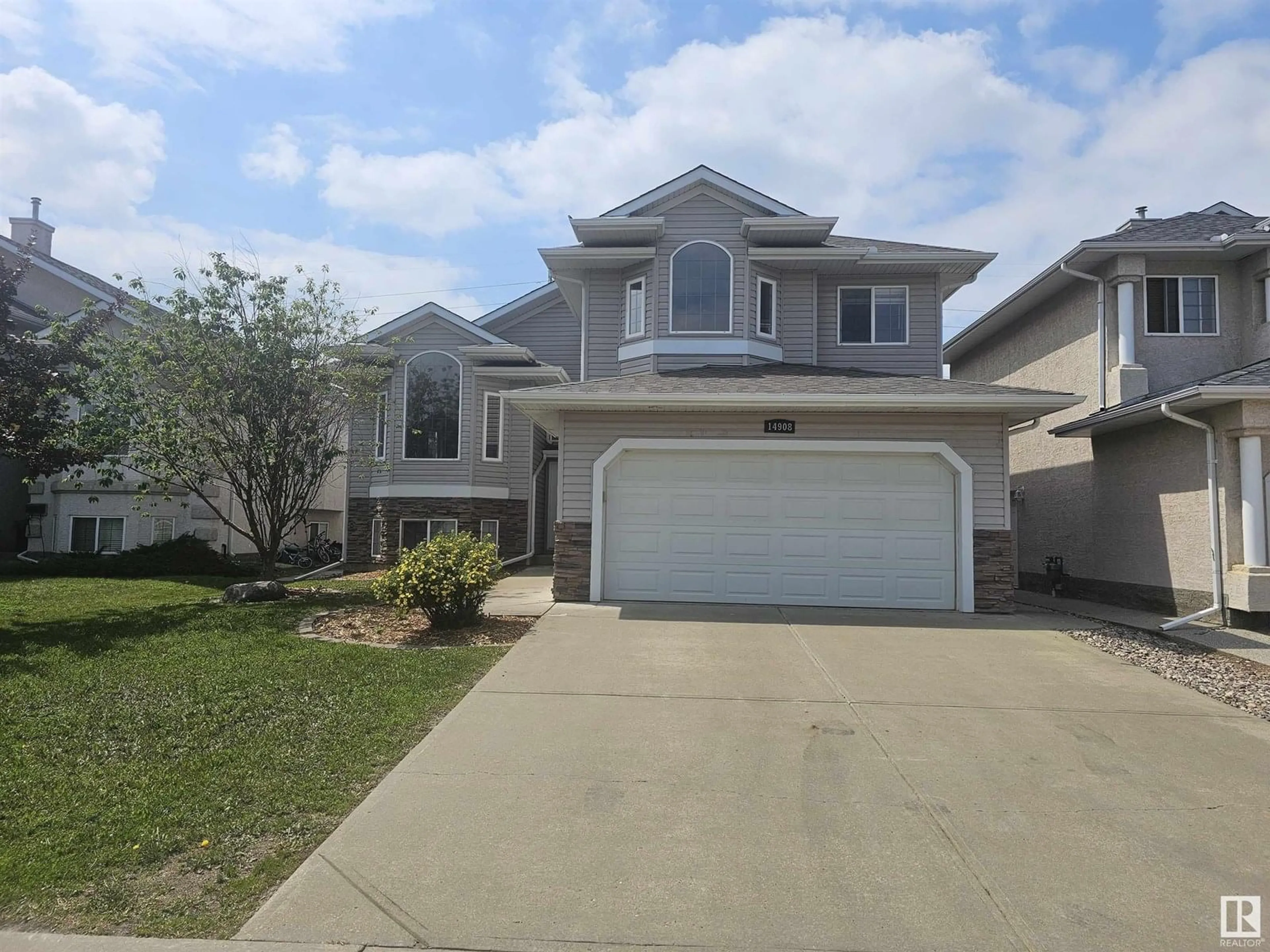 Home with vinyl exterior material, street for 14908 16 ST, Edmonton Alberta T5Y3J1