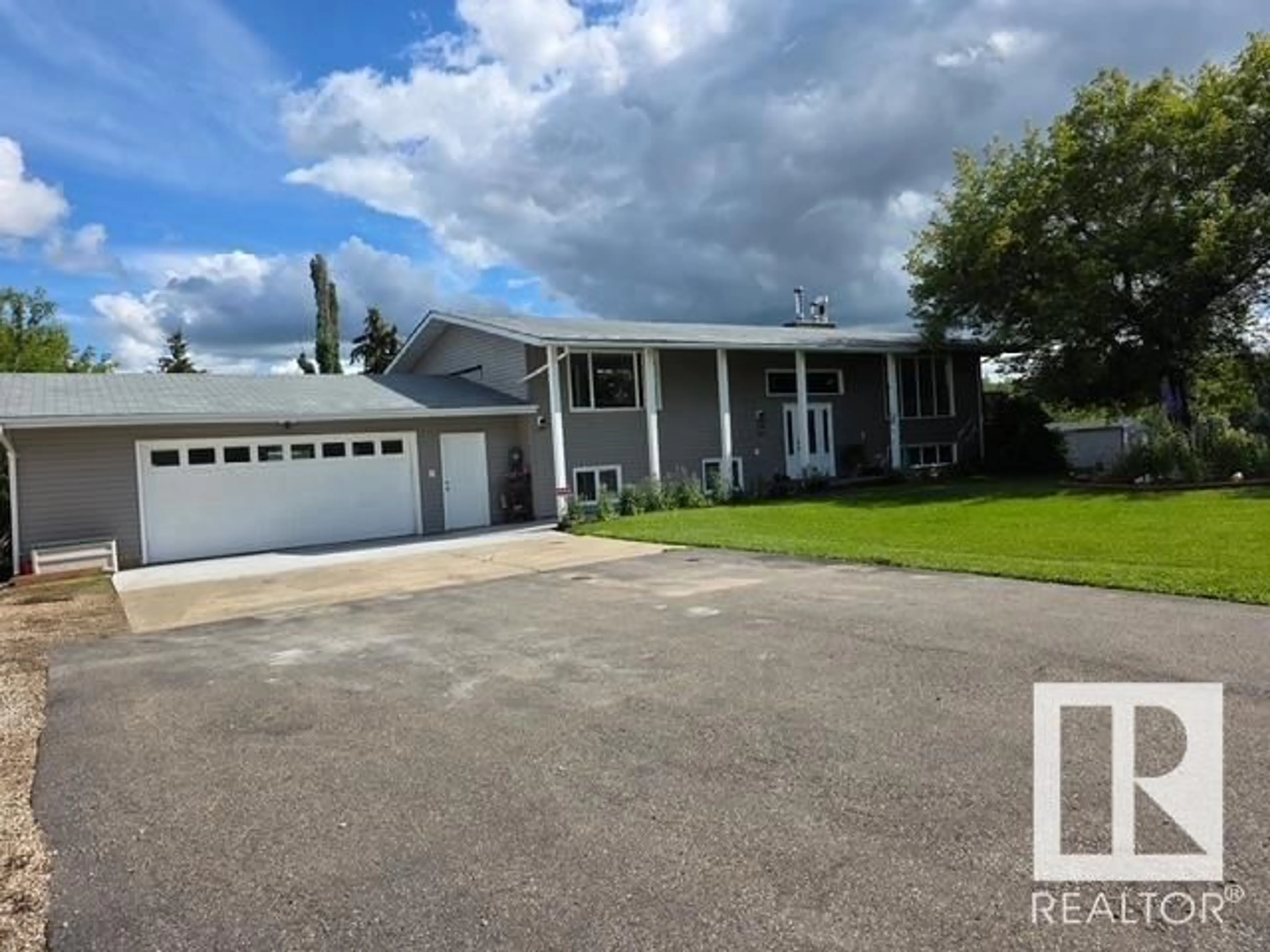 A pic from outside/outdoor area/front of a property/back of a property/a pic from drone, street for #13 - 53327 RGE ROAD 15, Rural Parkland County Alberta T7Y0C3