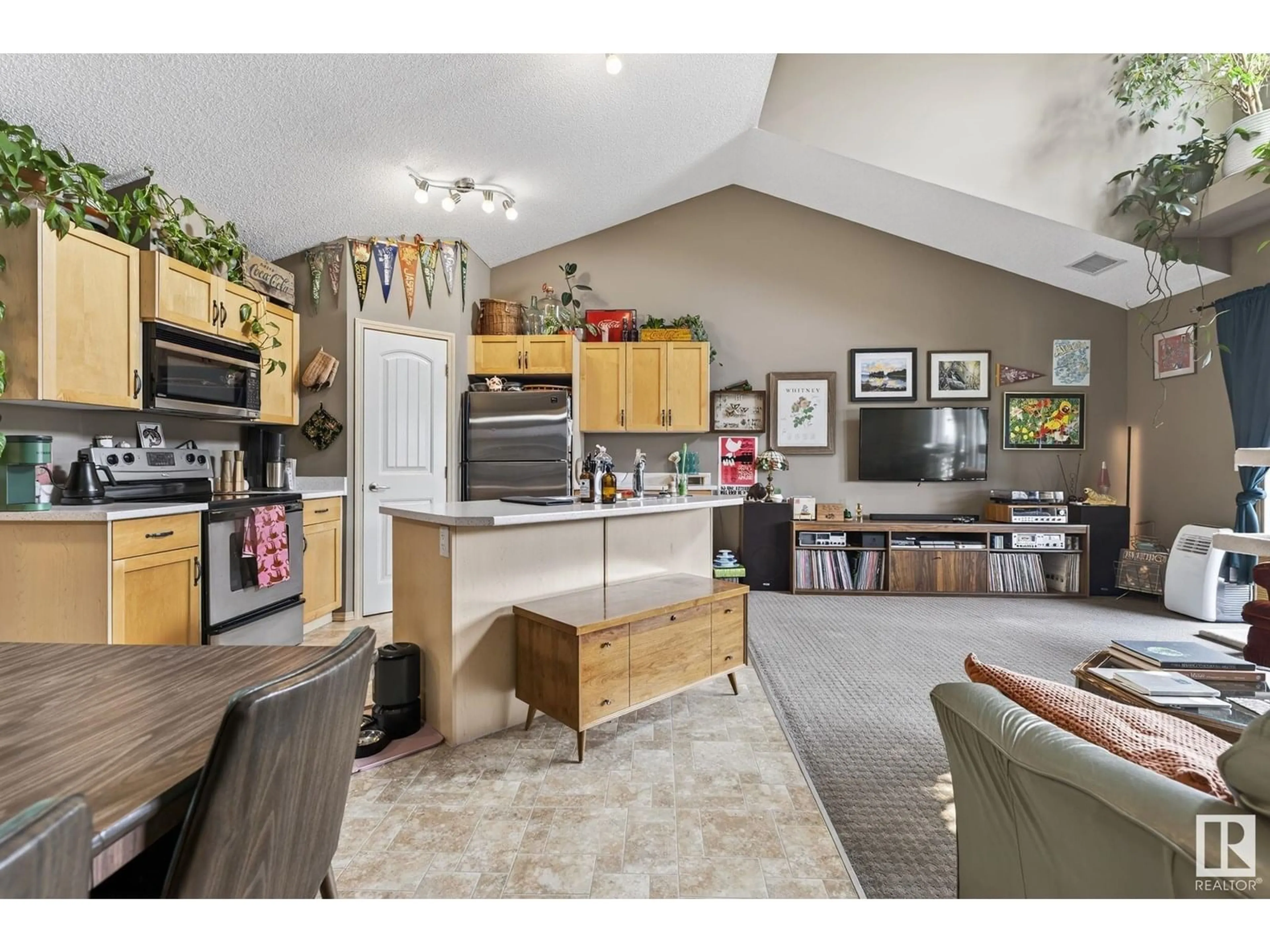 Open concept kitchen, wood/laminate floor for #95 - 604 62 ST, Edmonton Alberta T6X0K4