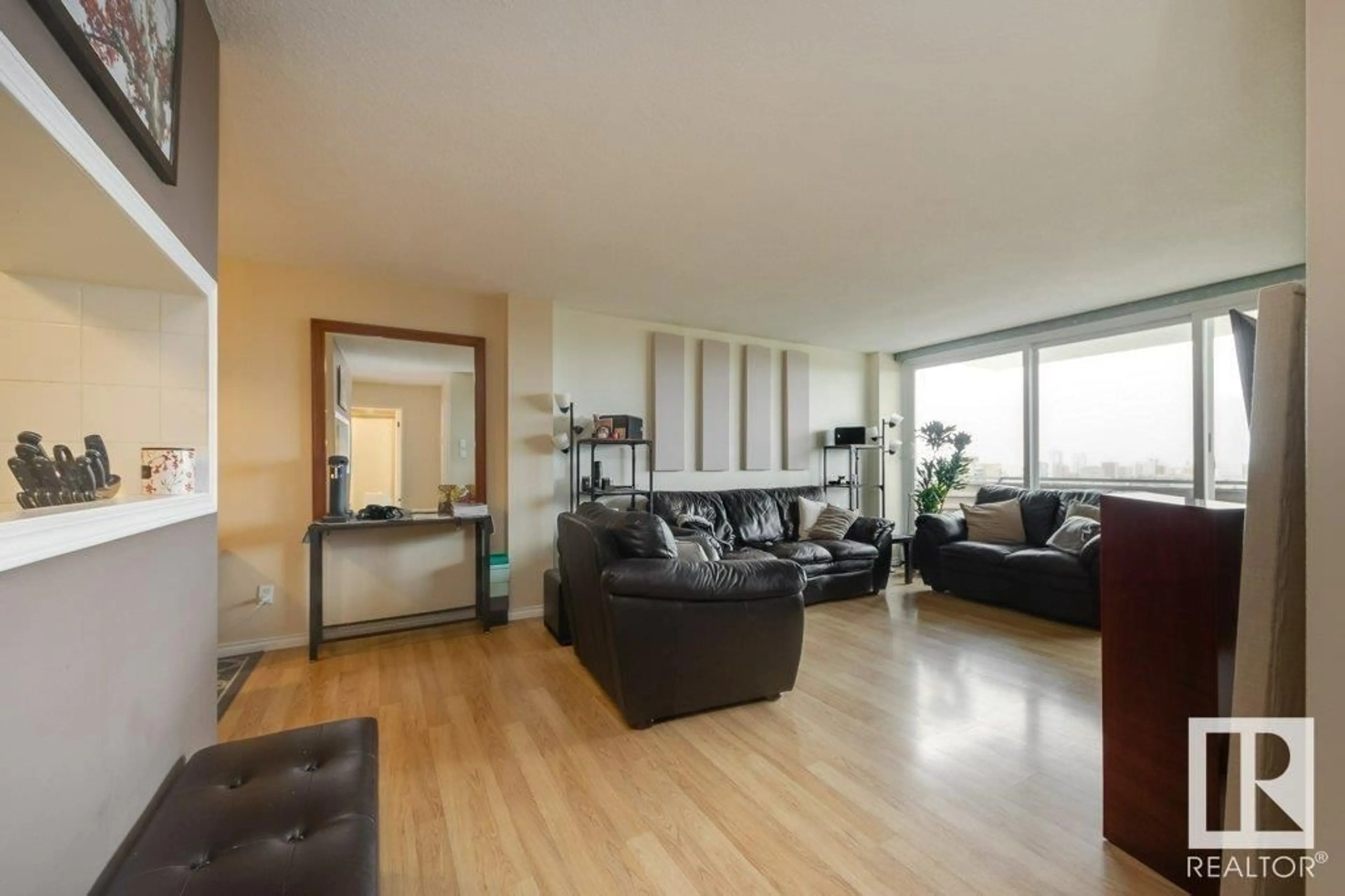 Living room with furniture, wood/laminate floor for 1106 - 8315 105 ST NW, Edmonton Alberta T6E4H4