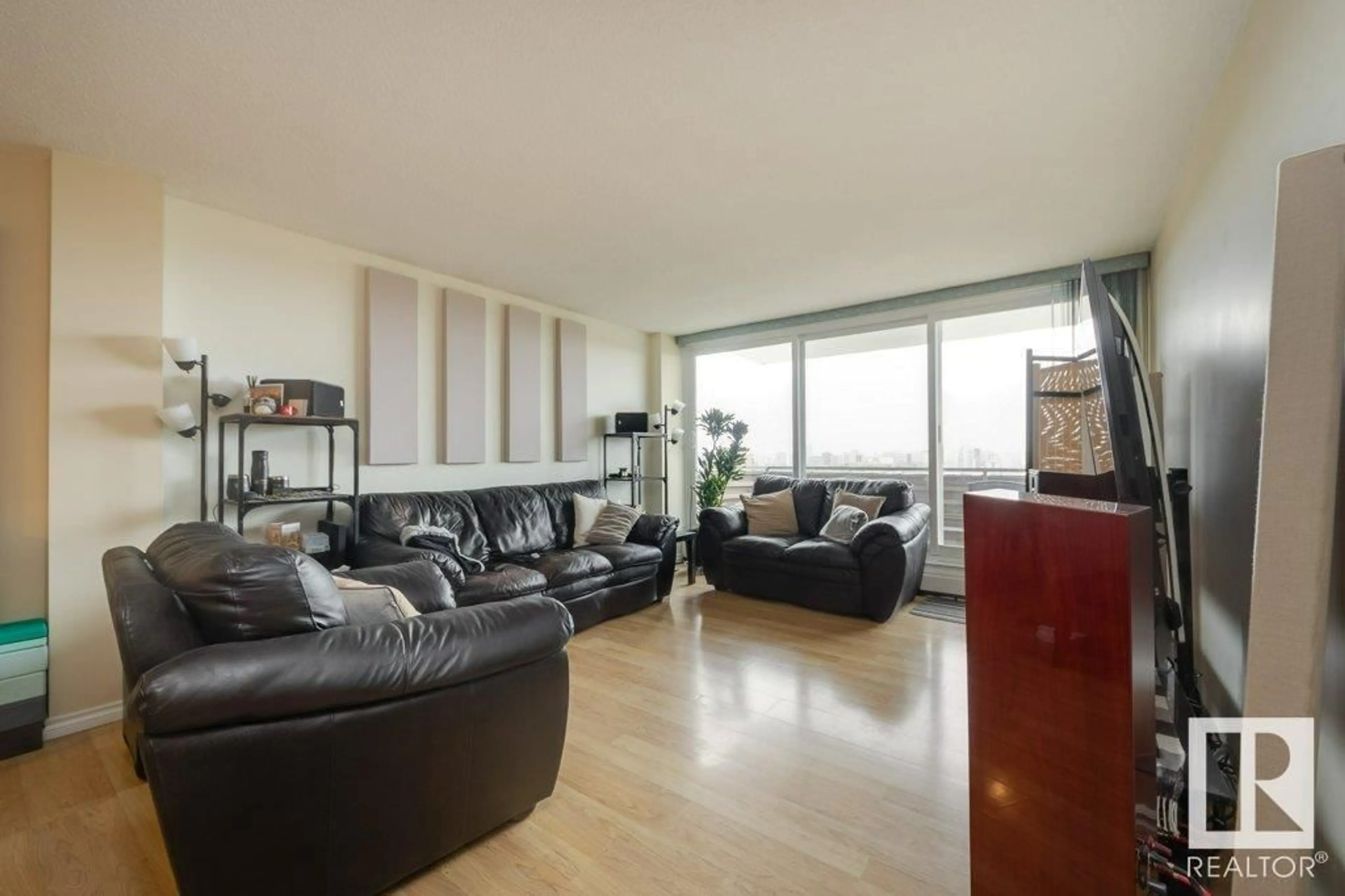 Living room with furniture, wood/laminate floor for 1106 - 8315 105 ST NW, Edmonton Alberta T6E4H4