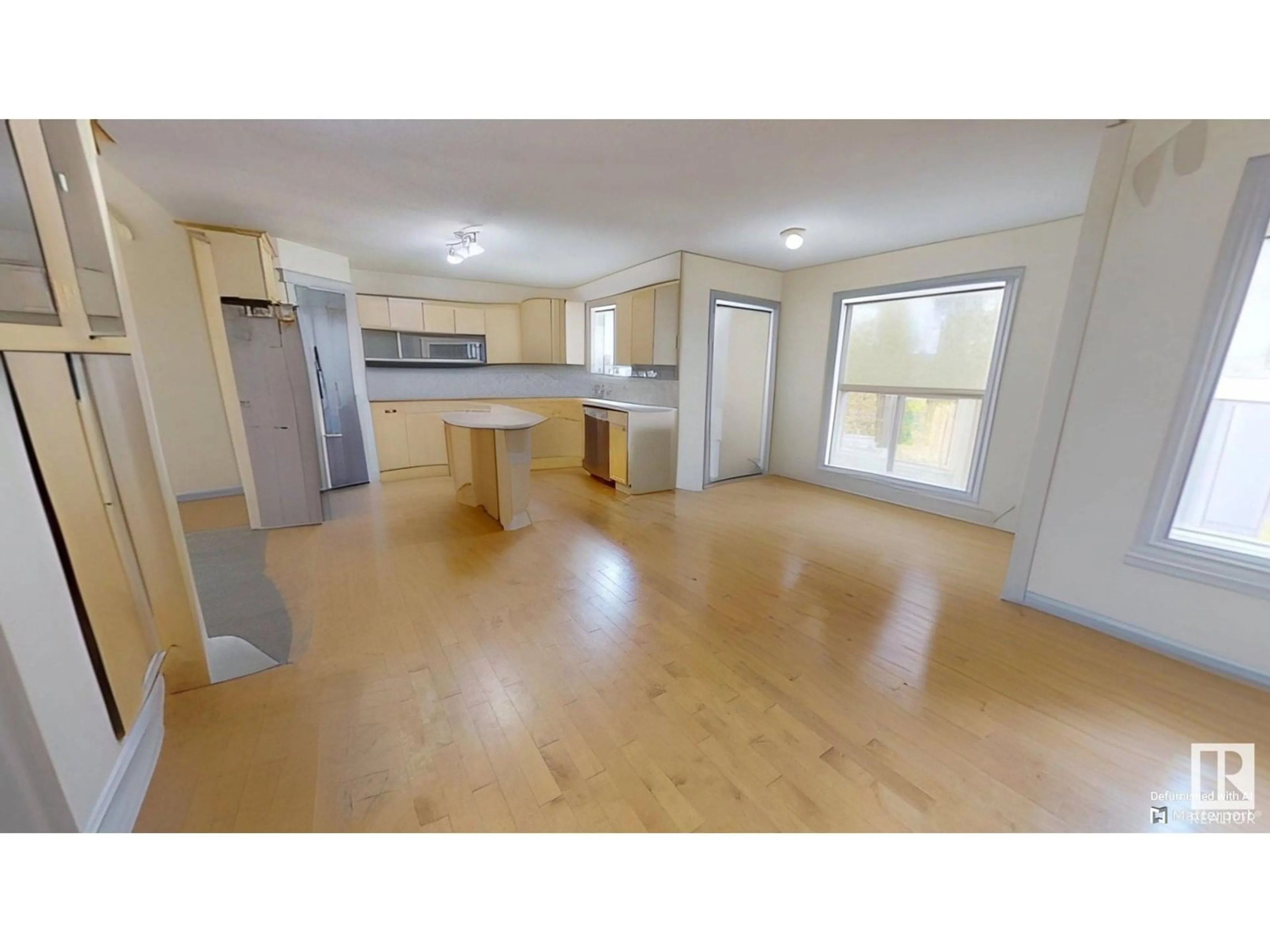 Open concept kitchen, wood/laminate floor for 32 CARRIERE CR, Beaumont Alberta T4X0A8
