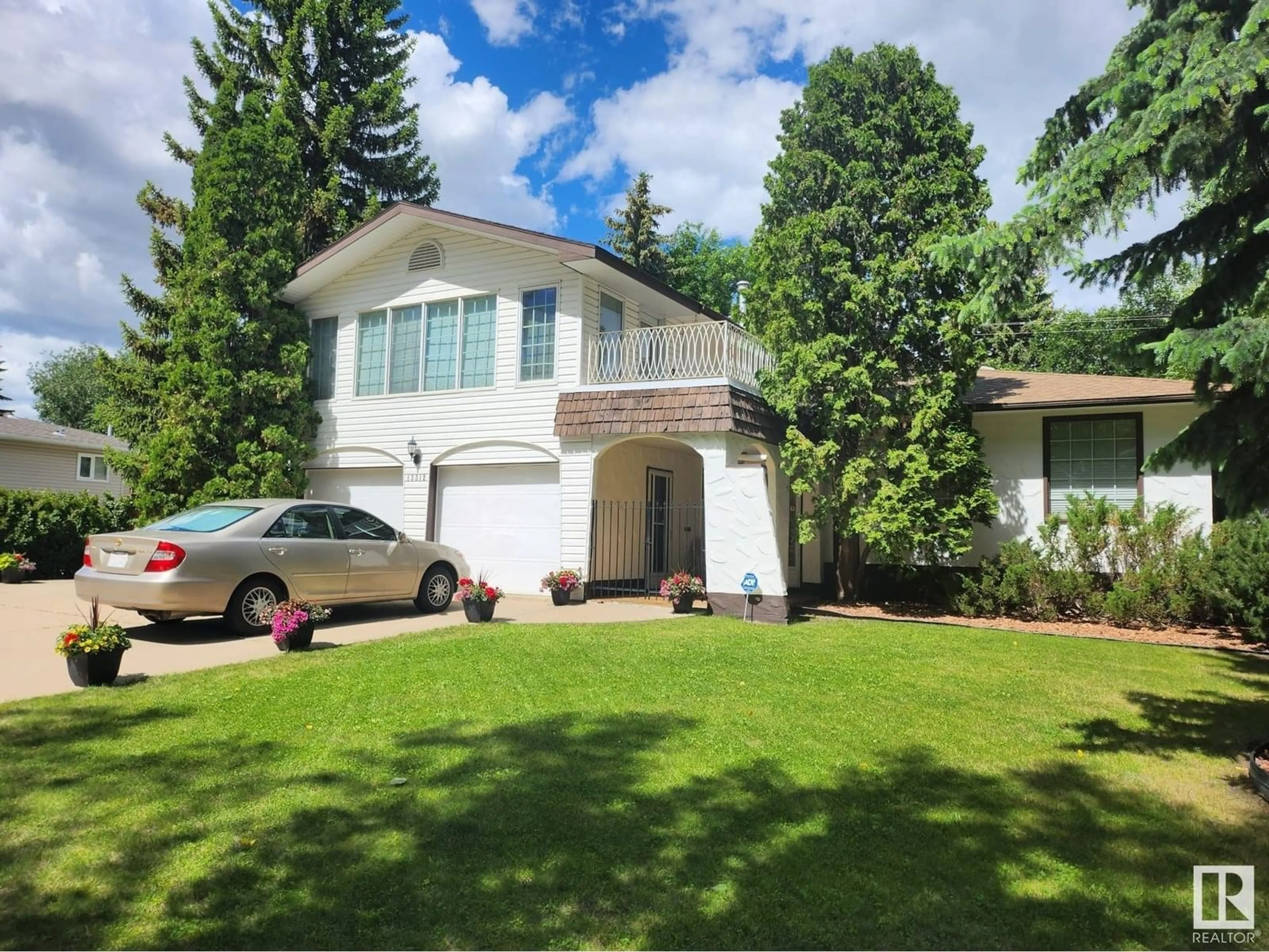 Home with vinyl exterior material, street for 13312 BUENA VISTA RD, Edmonton Alberta T5R5R2