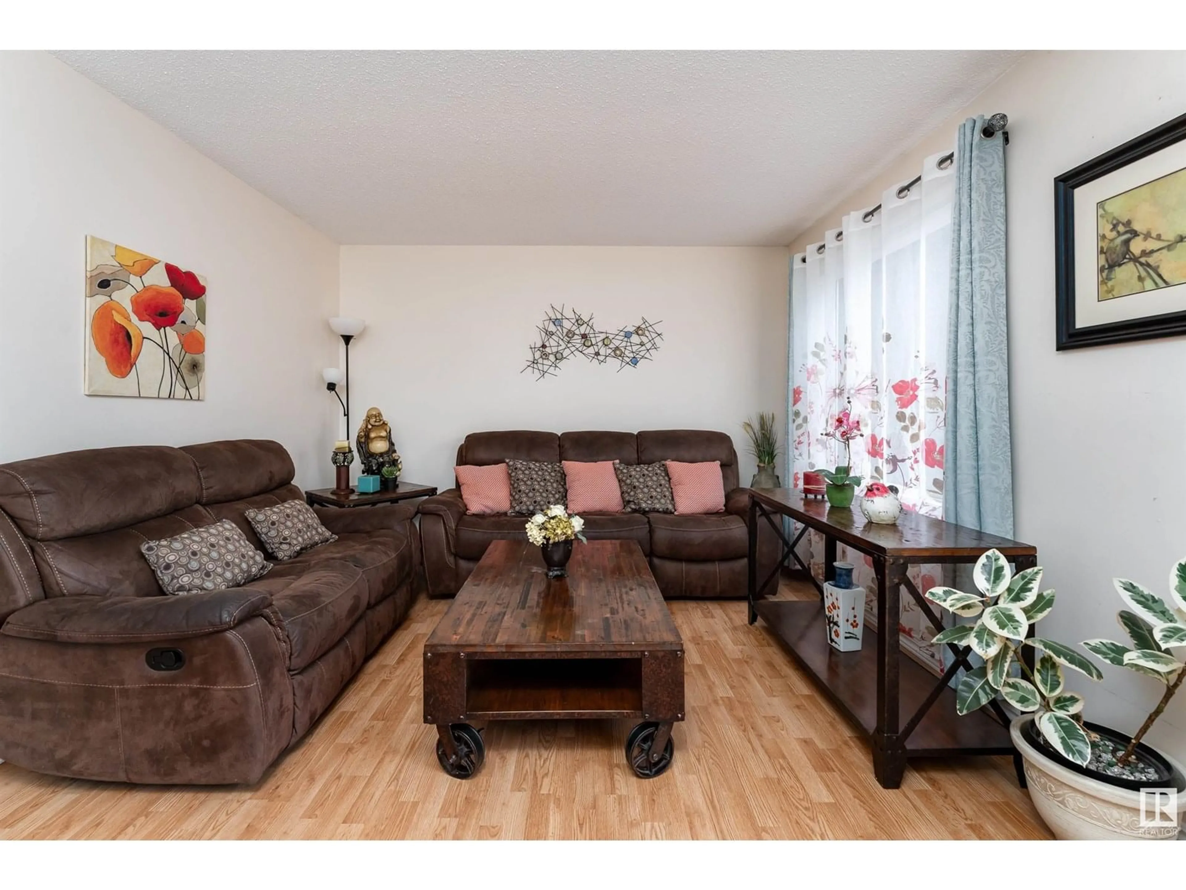 Living room with furniture, wood/laminate floor for 3195 139 AV, Edmonton Alberta T5Y1R4