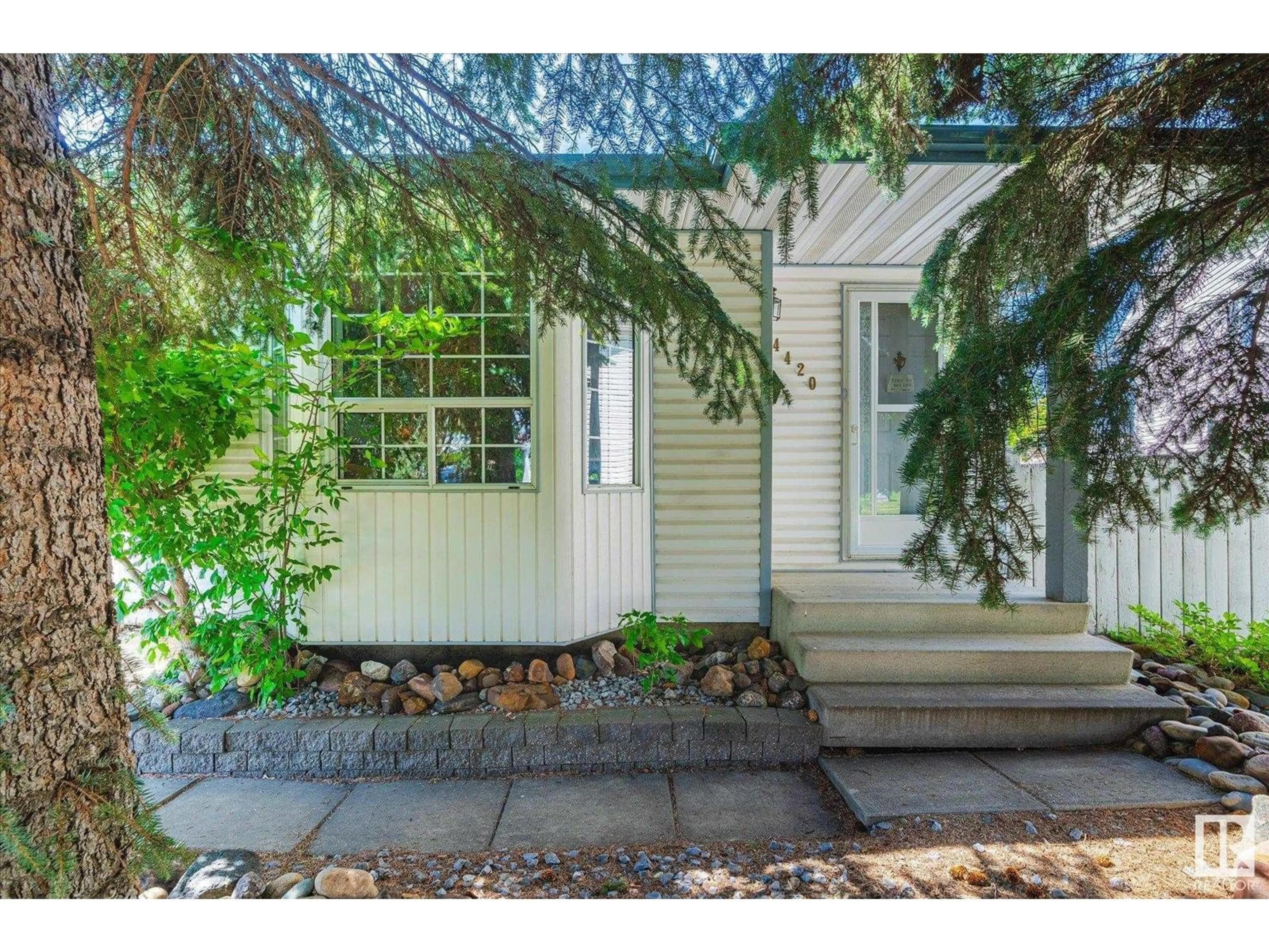 Home with vinyl exterior material, street for 4420 36A ST, Edmonton Alberta T6L6K5