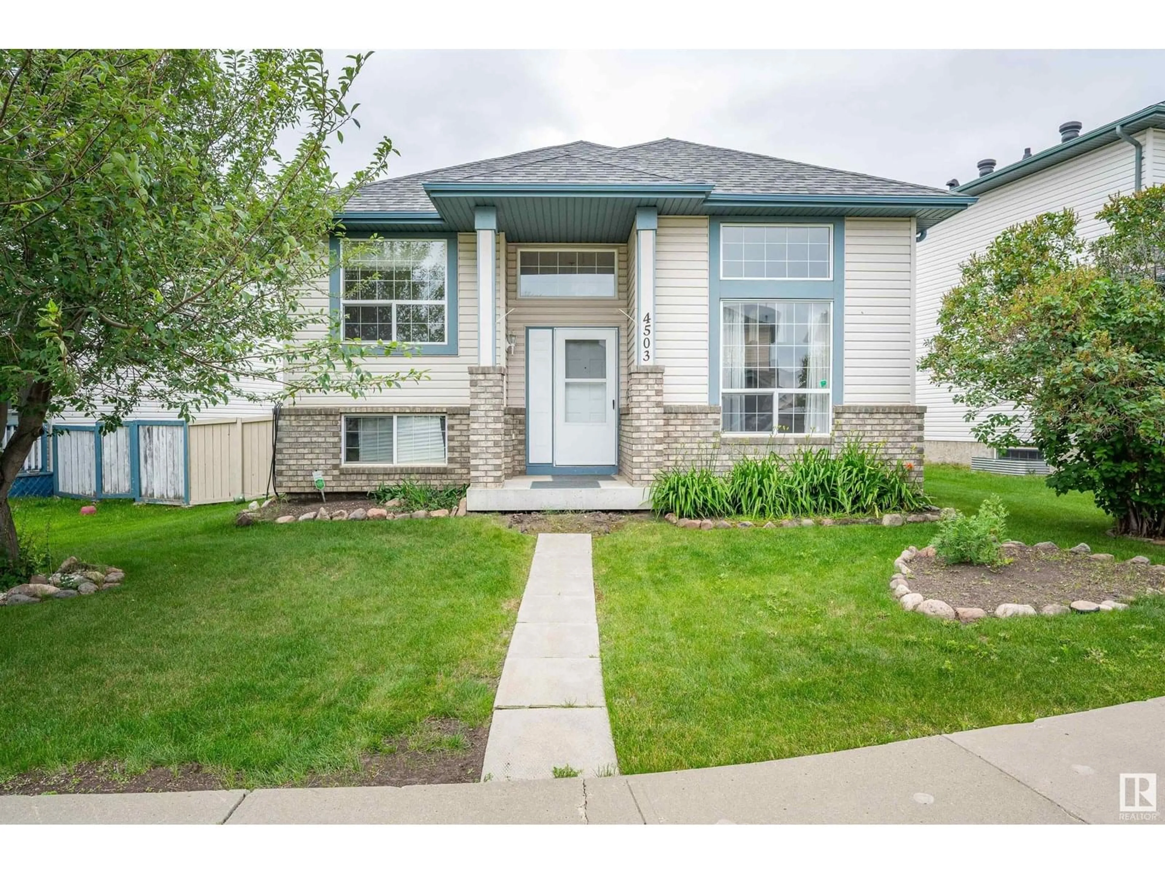 Home with vinyl exterior material, street for 4503 149 AV, Edmonton Alberta T5Y2Y9