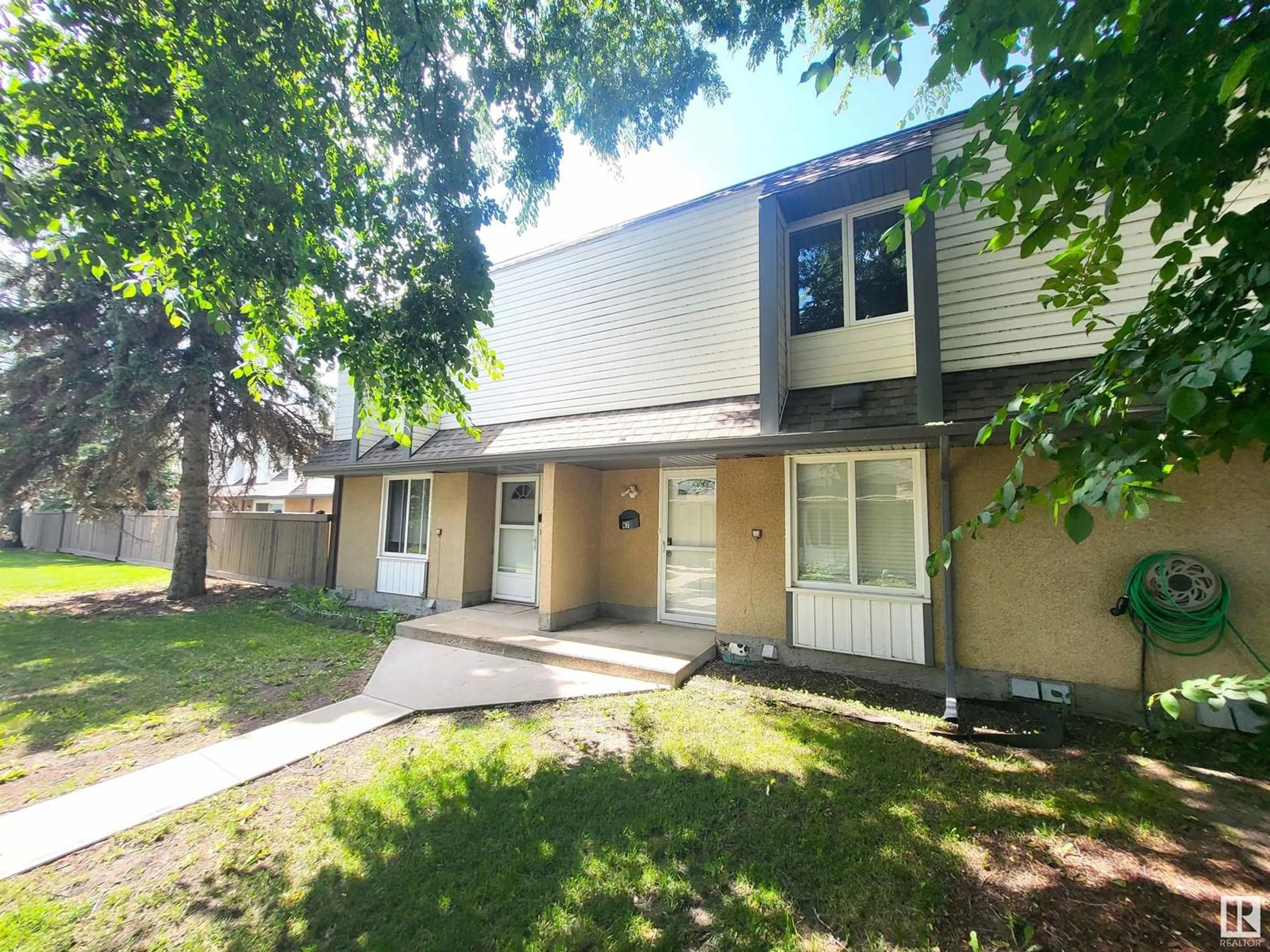 A pic from outside/outdoor area/front of a property/back of a property/a pic from drone, street for H7 - 1 GARDEN GROVE GV, Edmonton Alberta T6J2L3