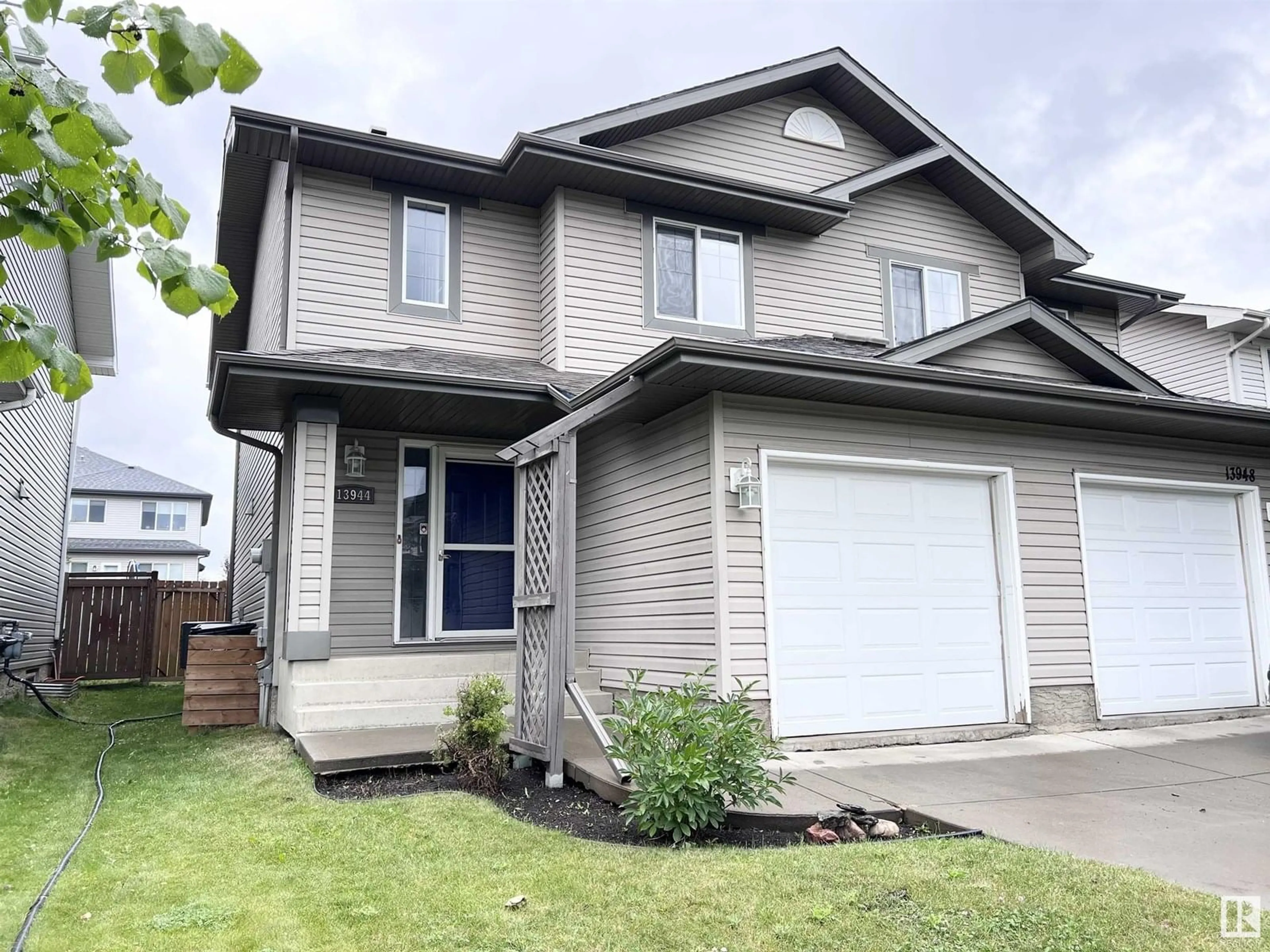 Home with vinyl exterior material, street for 13944 137 ST, Edmonton Alberta T6V1X3