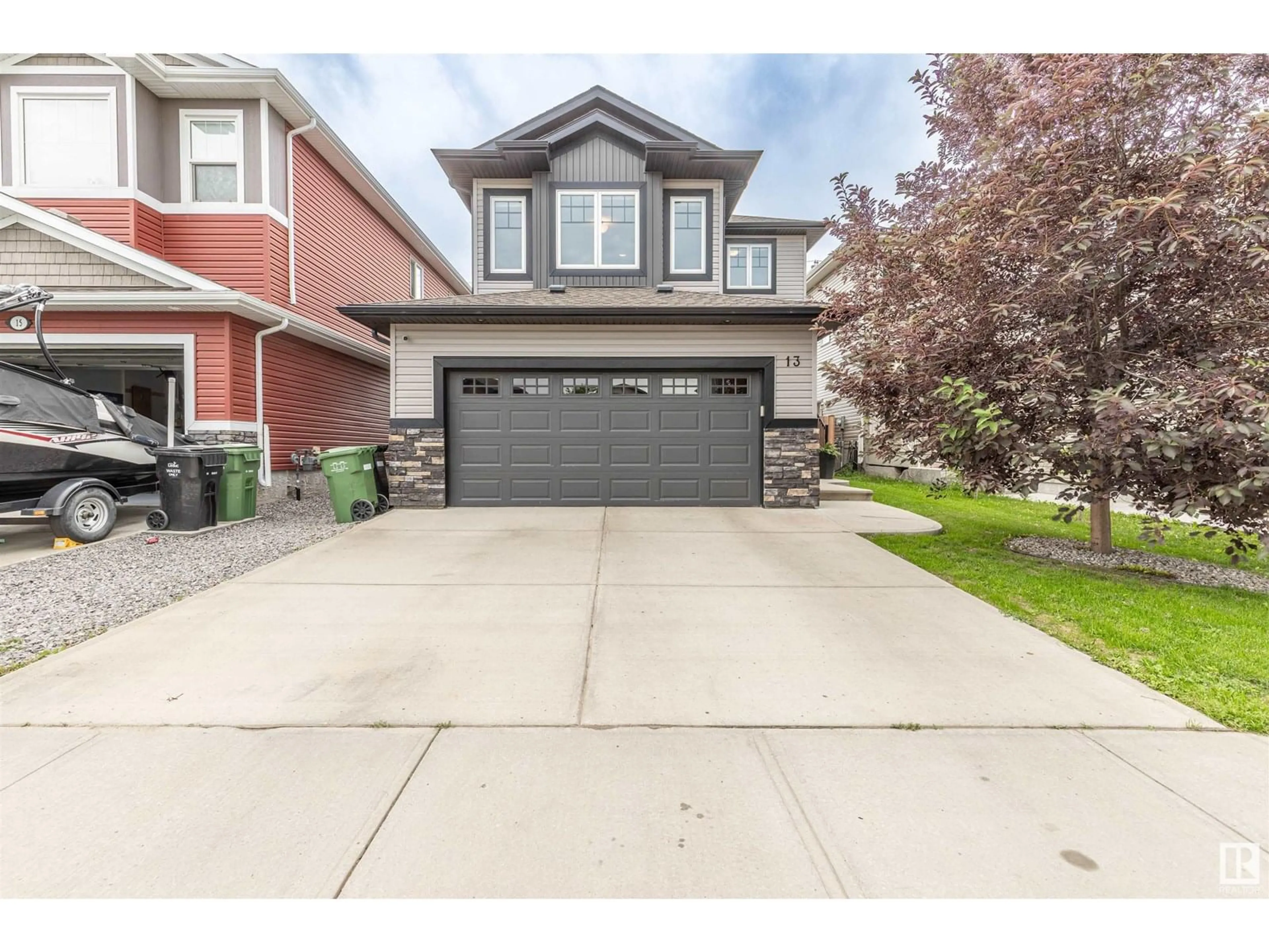 Home with vinyl exterior material, street for 13 SANDALWOOD PL, Leduc Alberta T9E1C2