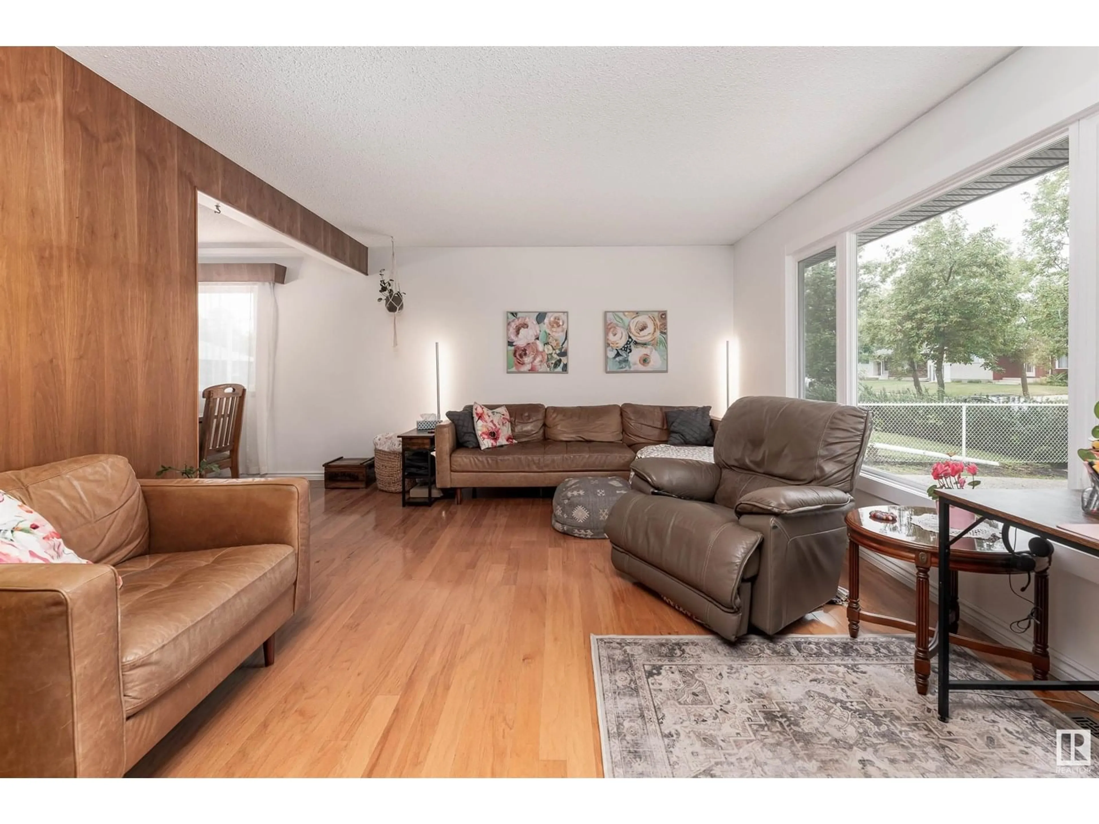 Living room with furniture, wood/laminate floor for 9015 96 ST, Fort Saskatchewan Alberta T8L1S1