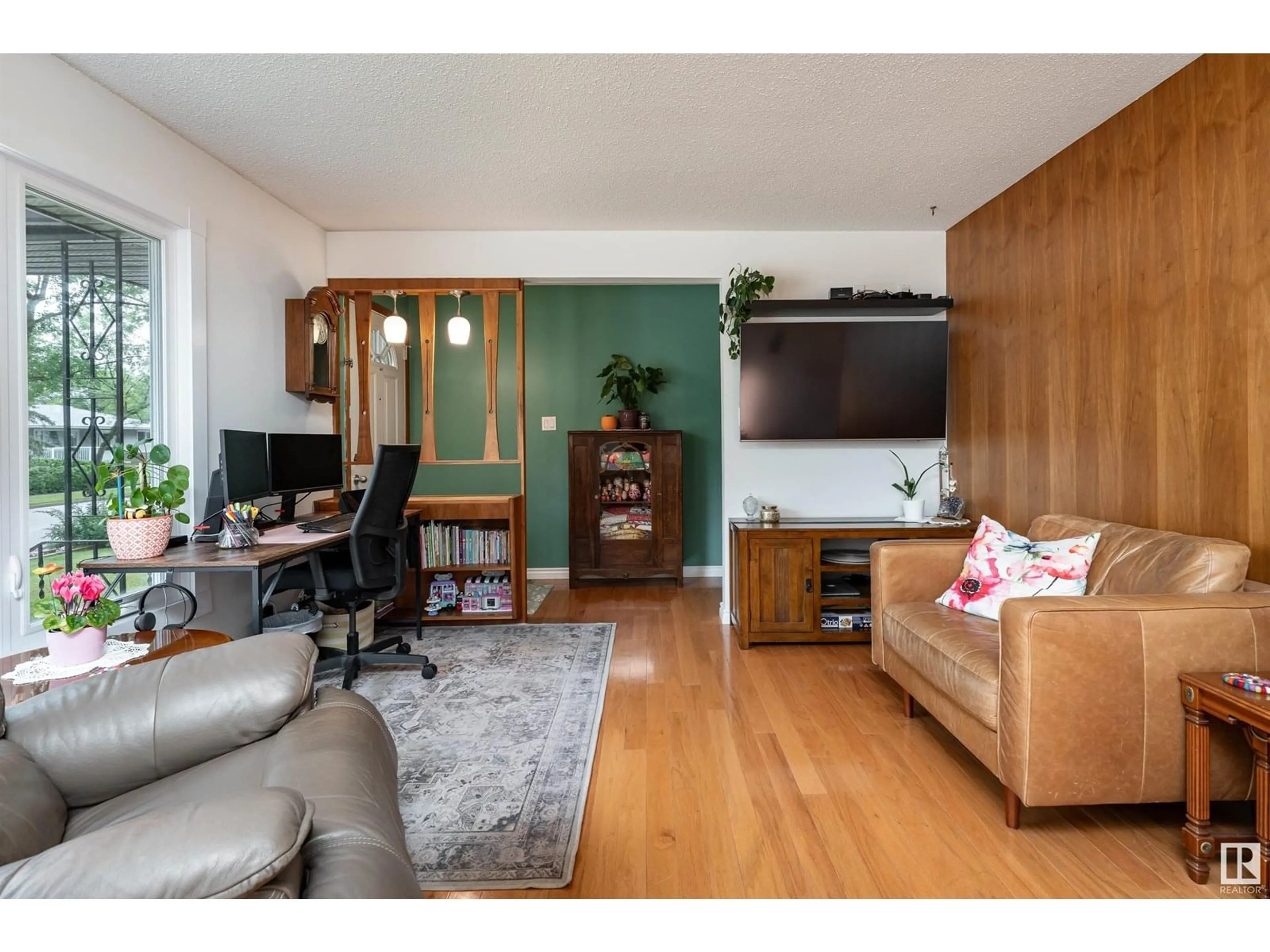 Living room with furniture, wood/laminate floor for 9015 96 ST, Fort Saskatchewan Alberta T8L1S1