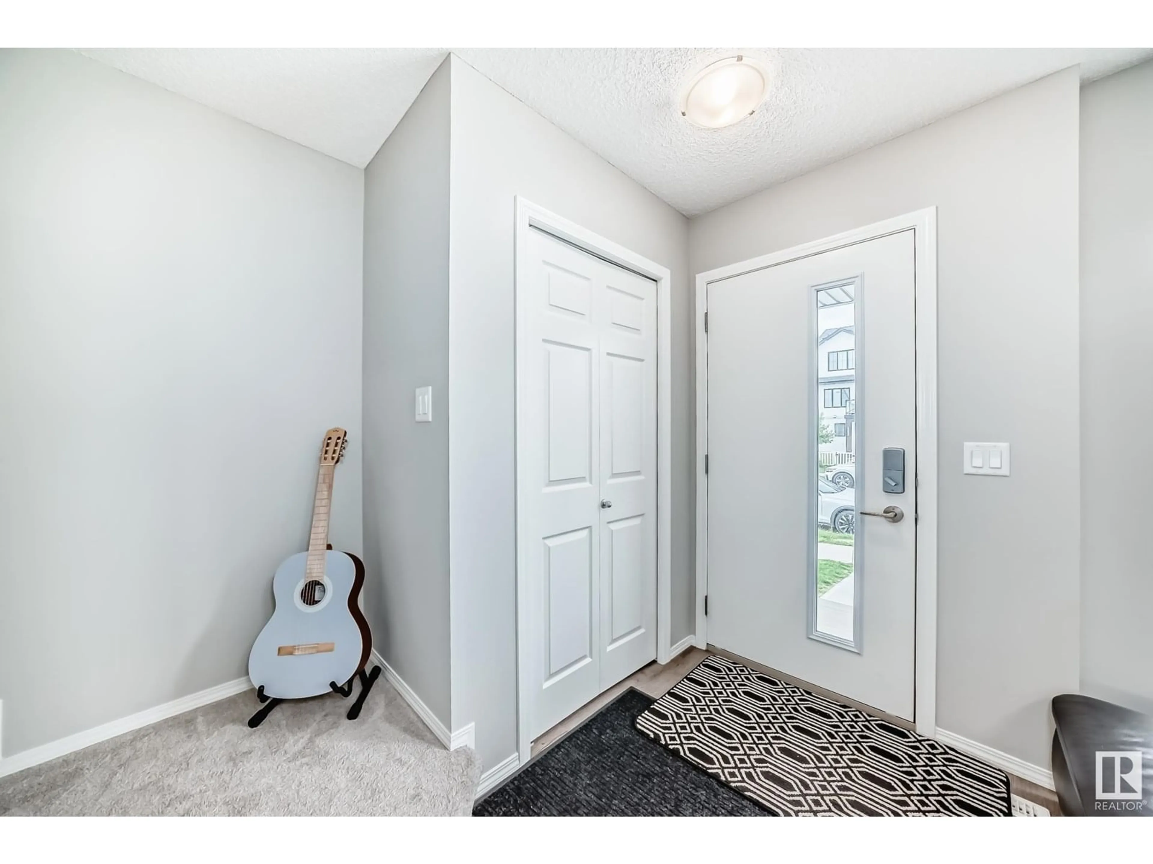 Indoor entryway for 19327 27 AV, Edmonton Alberta T6M1K9