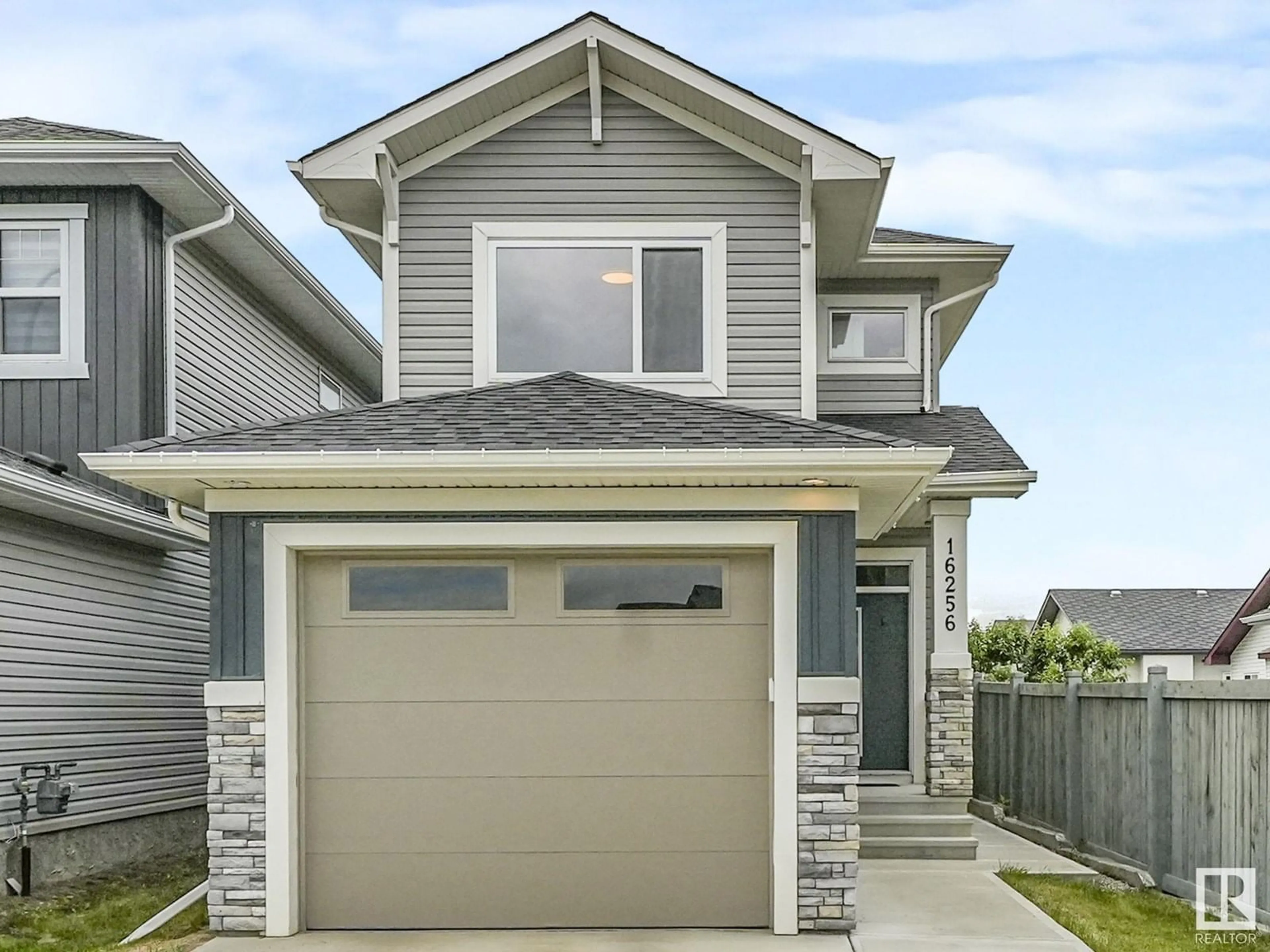 Home with vinyl exterior material, street for NW - 16256 64 ST, Edmonton Alberta T5Y3E2
