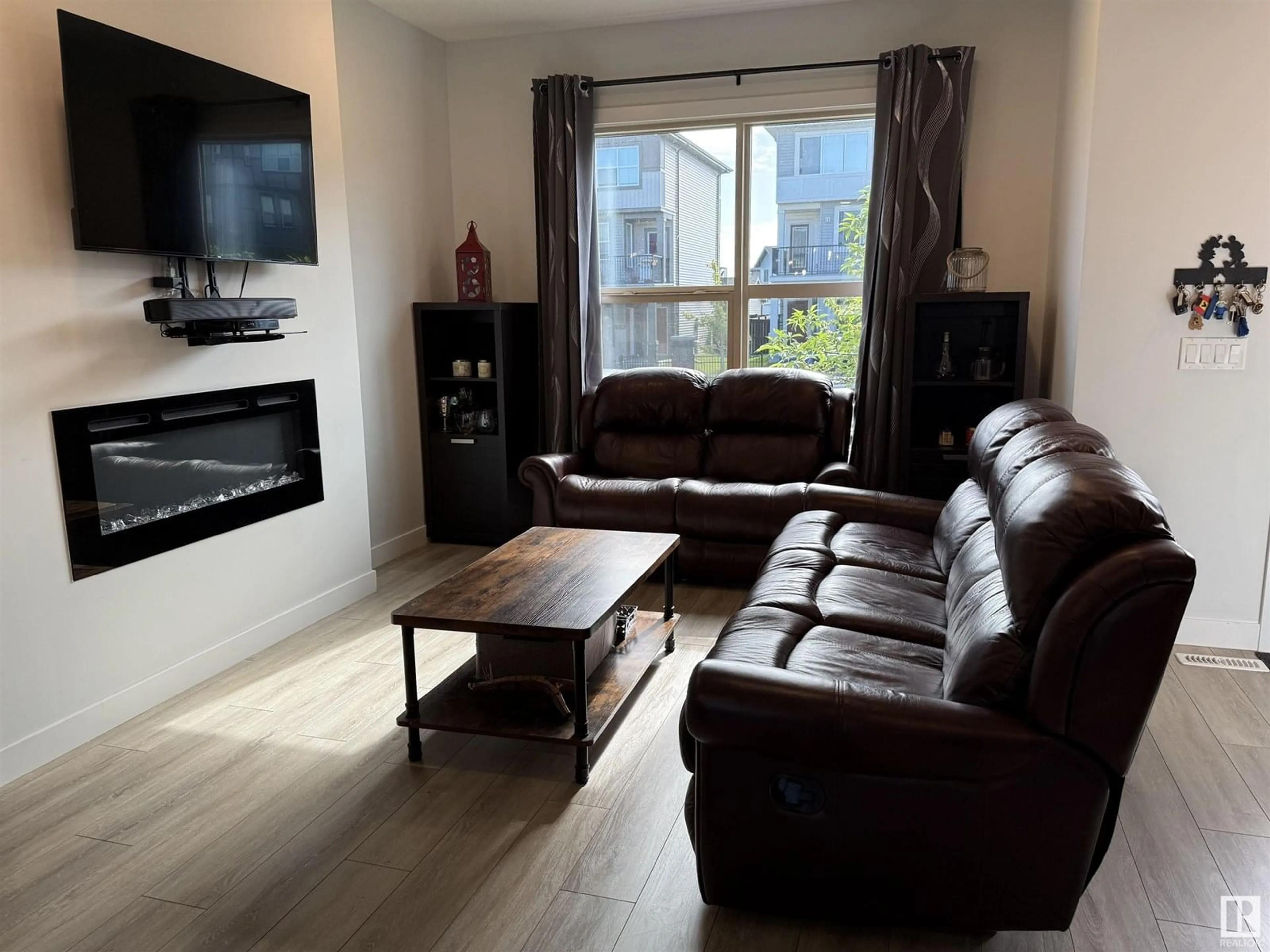 Living room with furniture, wood/laminate floor for 405 PIONEER RD, Spruce Grove Alberta T7X0T2