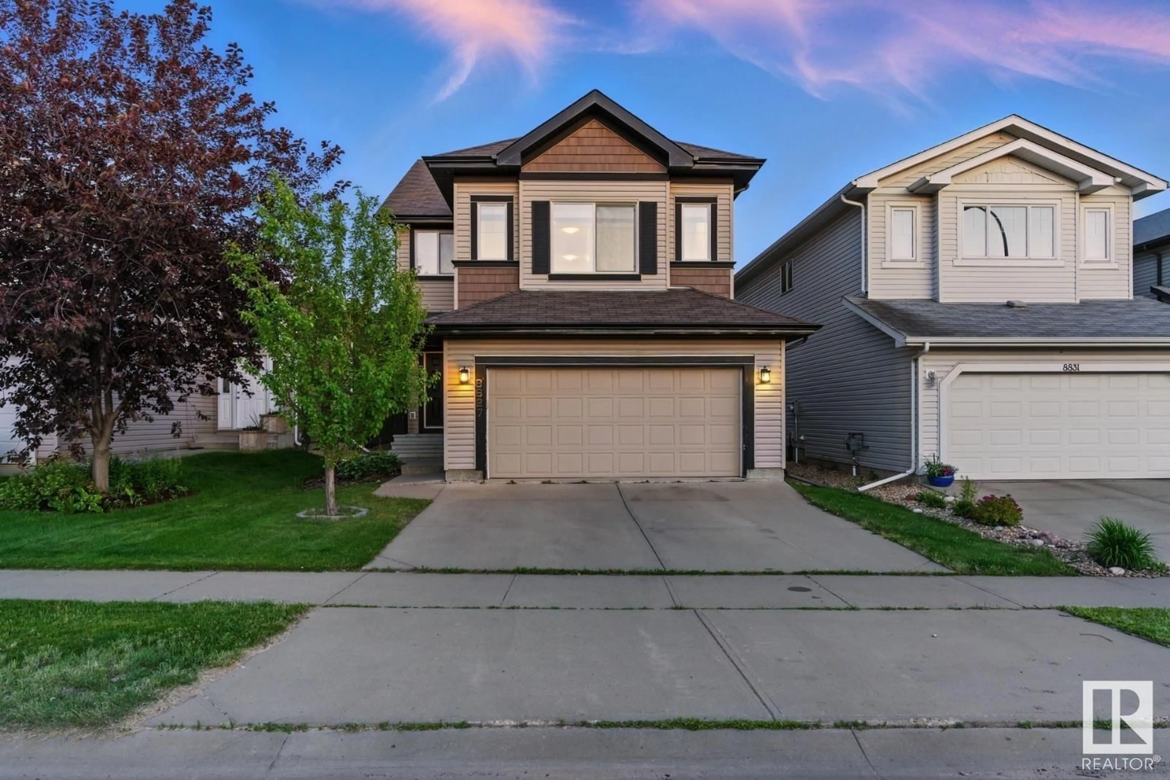 Home with vinyl exterior material, street for 8827 180 AV, Edmonton Alberta T5Z0C4