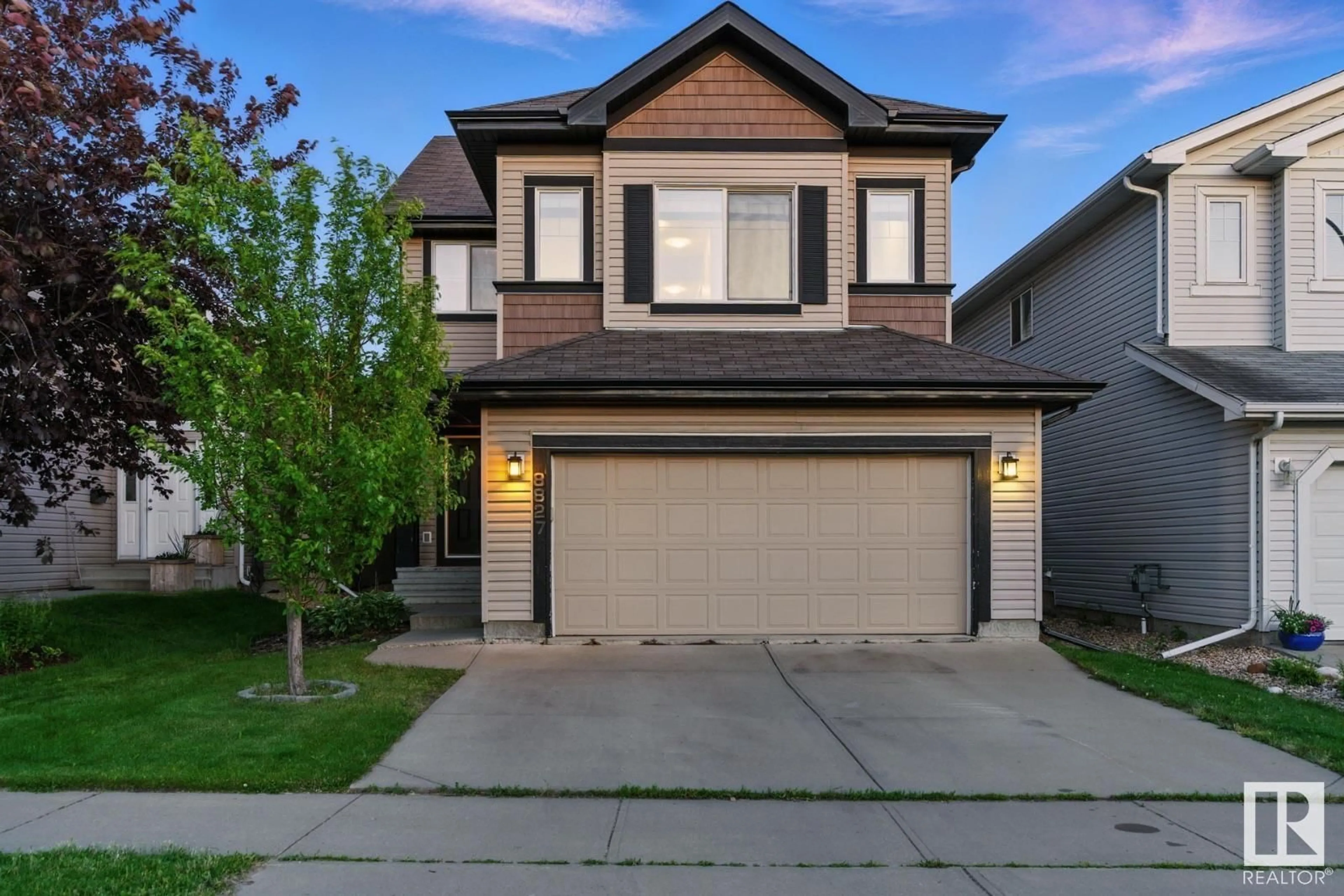 Home with vinyl exterior material, street for 8827 180 AV, Edmonton Alberta T5Z0C4
