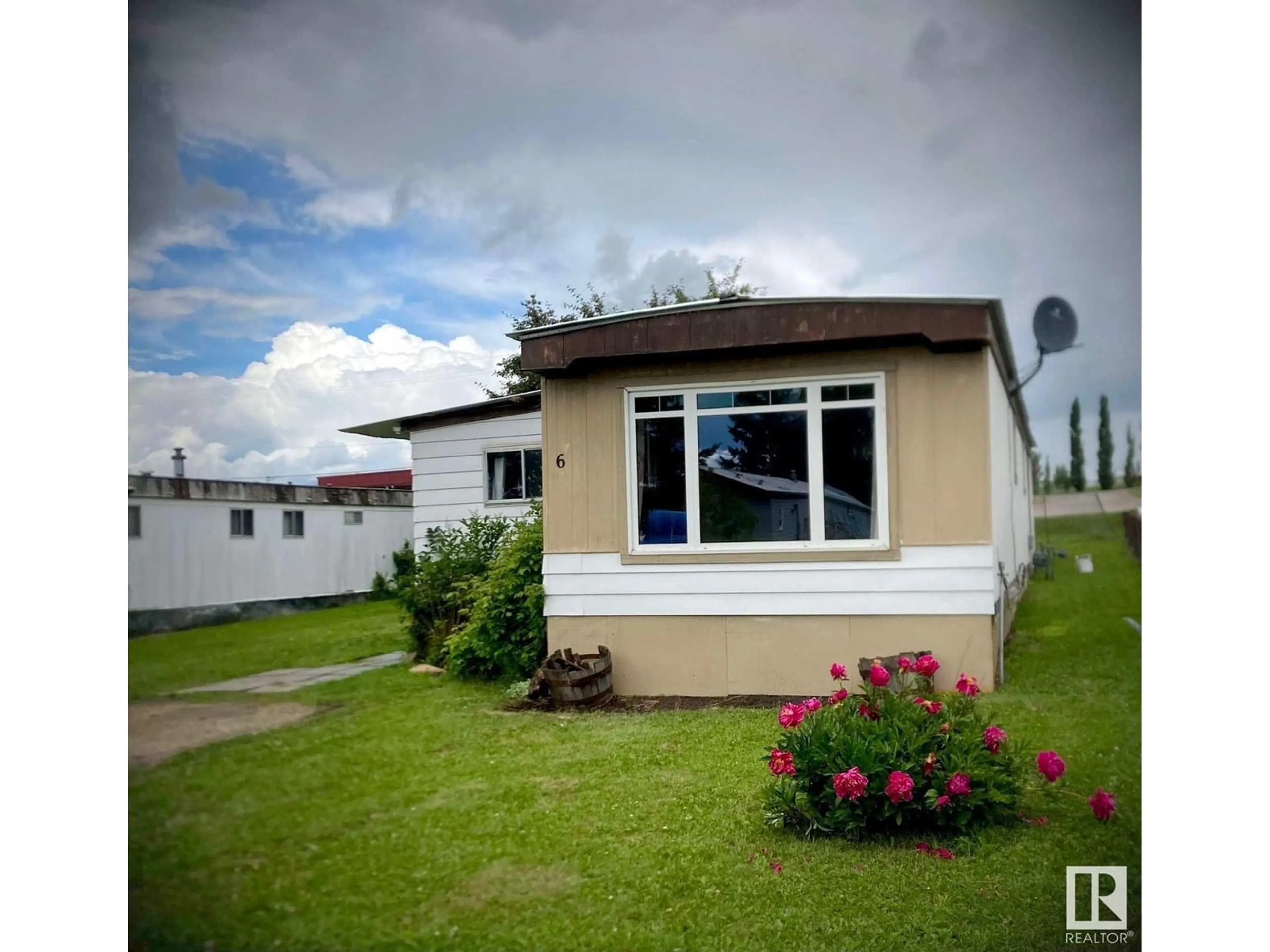 Home with vinyl exterior material, street for 5424 48A AVE, Drayton Valley Alberta T7A1J8