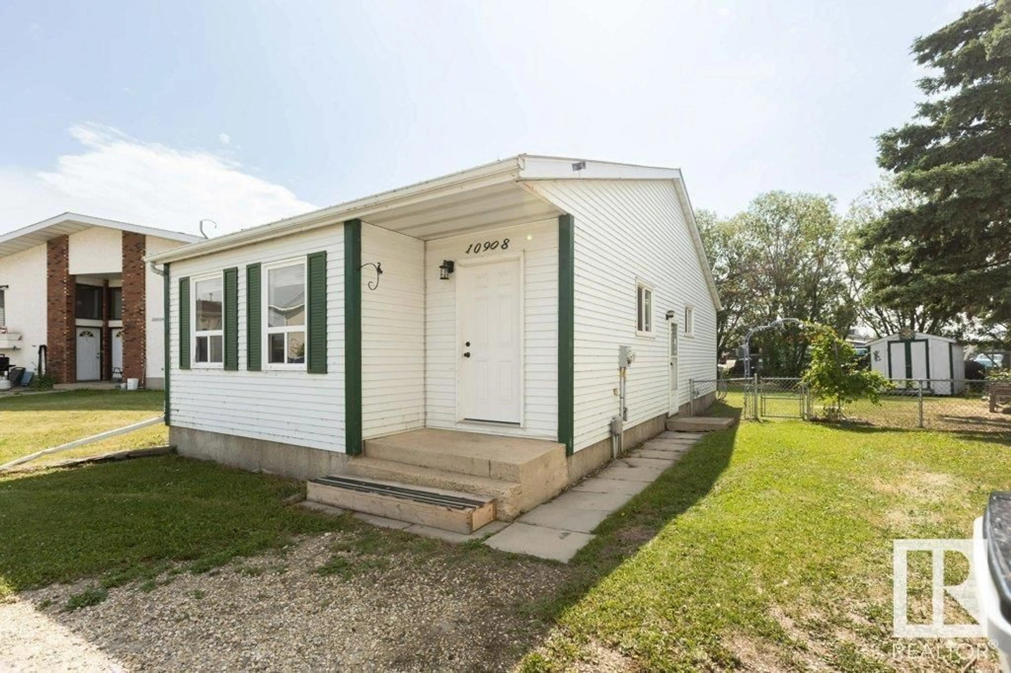 Home with vinyl exterior material, street for 10908 105 AV, Westlock Alberta T7P1A8