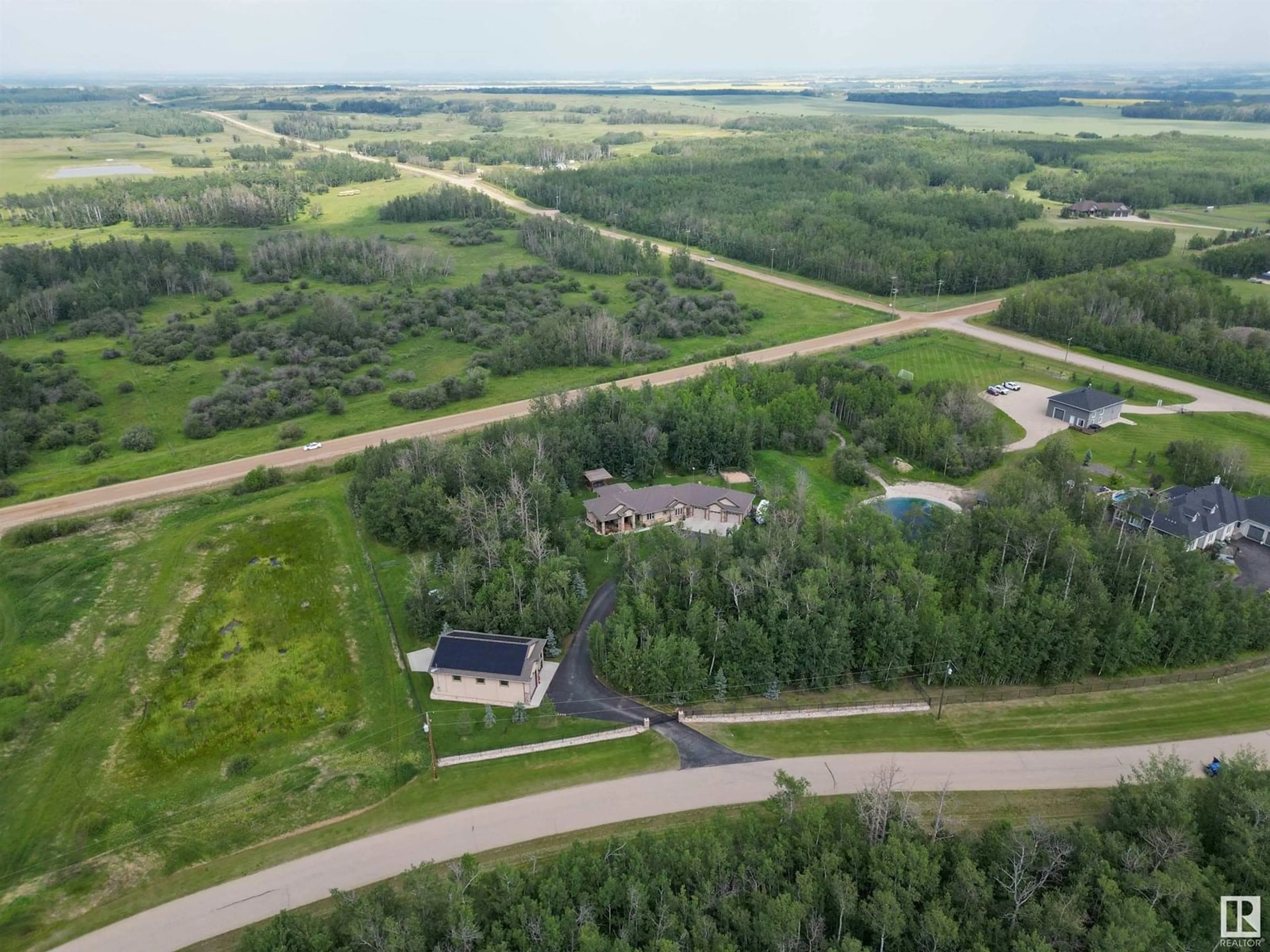 A pic from outside/outdoor area/front of a property/back of a property/a pic from drone, unknown for 55 53522 RGE ROAD 272, Rural Parkland County Alberta T7X2N3