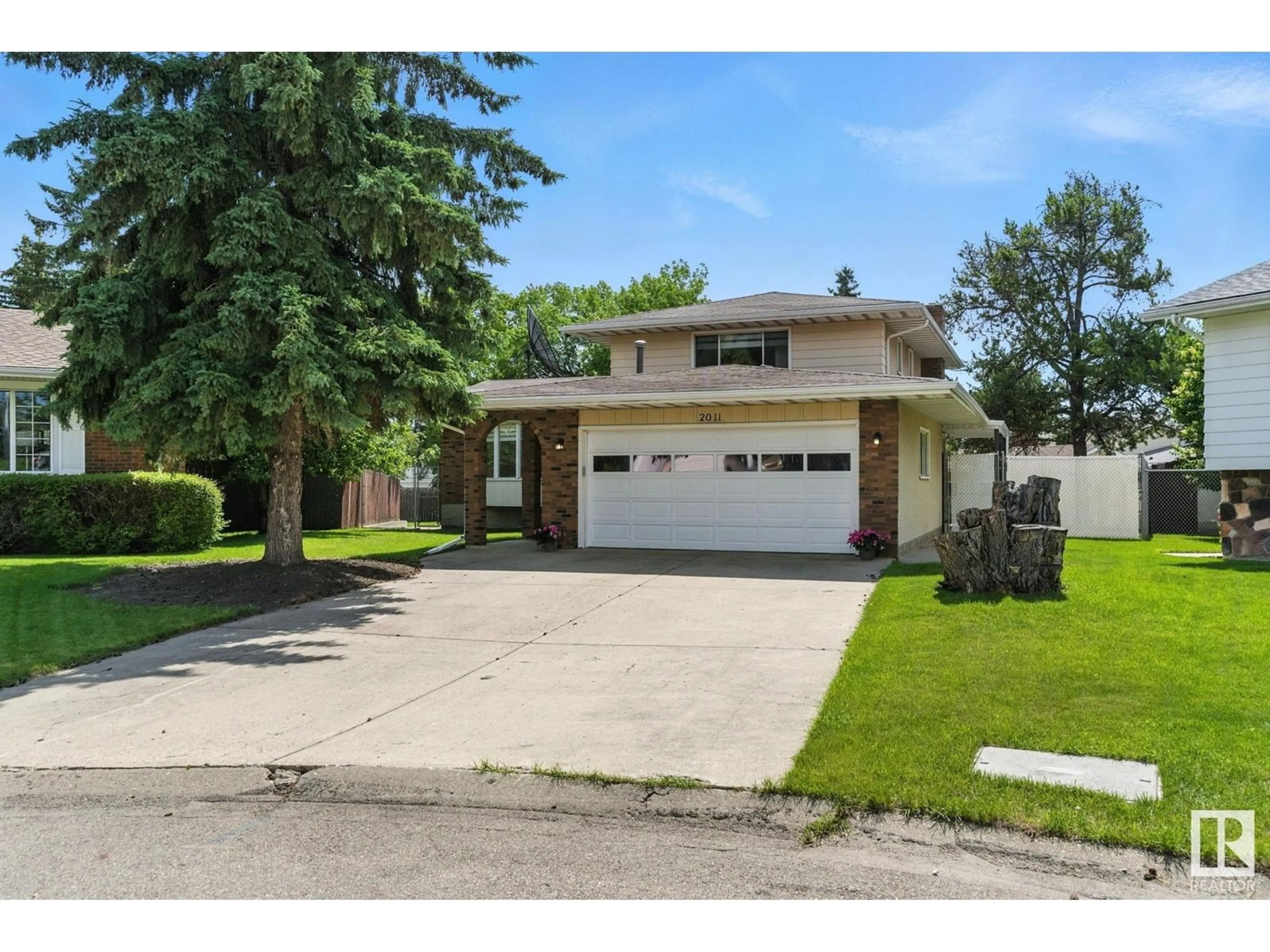 Home with brick exterior material, street for NW - 2011 89 ST, Edmonton Alberta T6K2A2