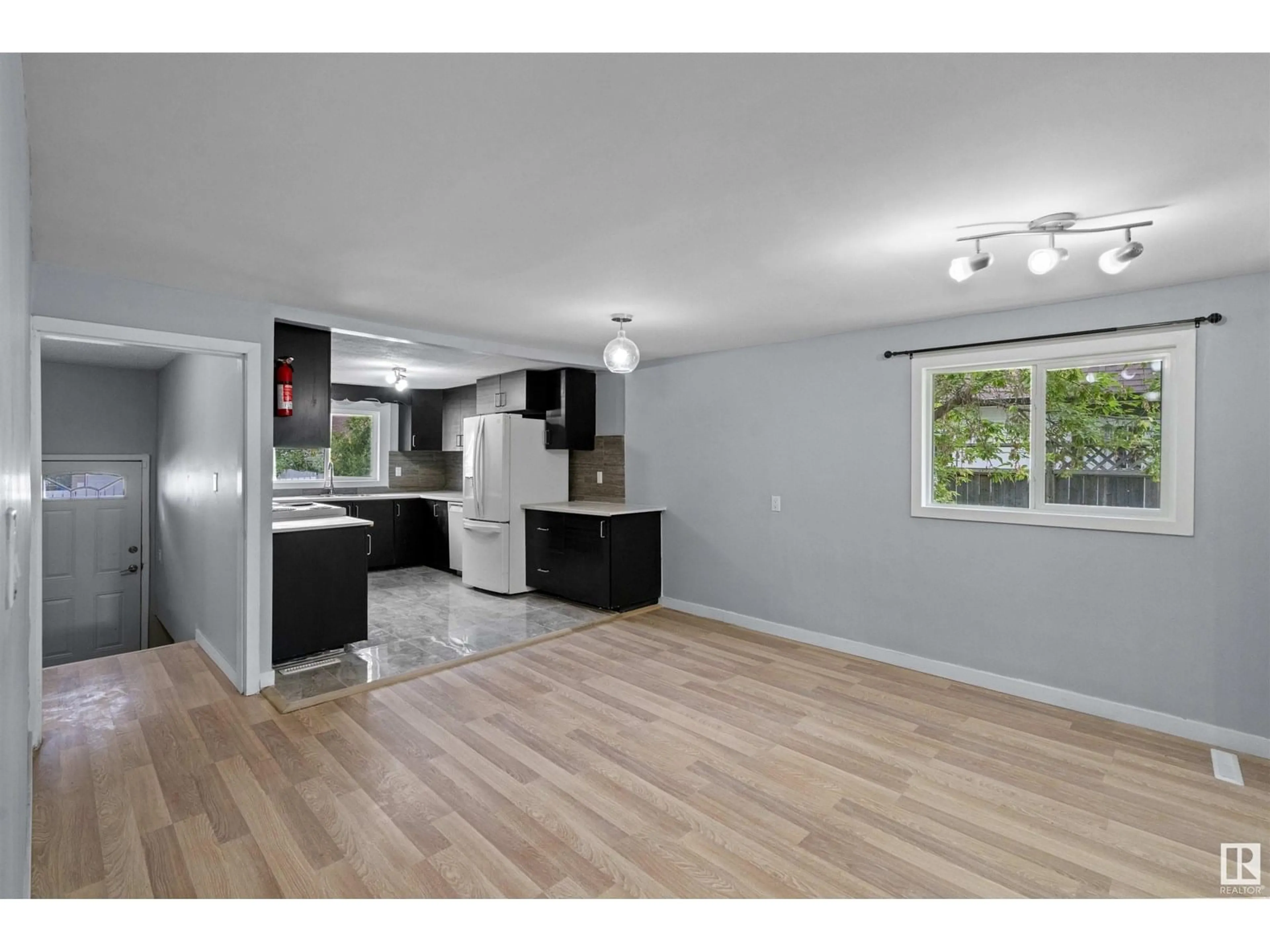 Open concept kitchen, wood/laminate floor for 5319 55 ST, Camrose Alberta T4V2B9