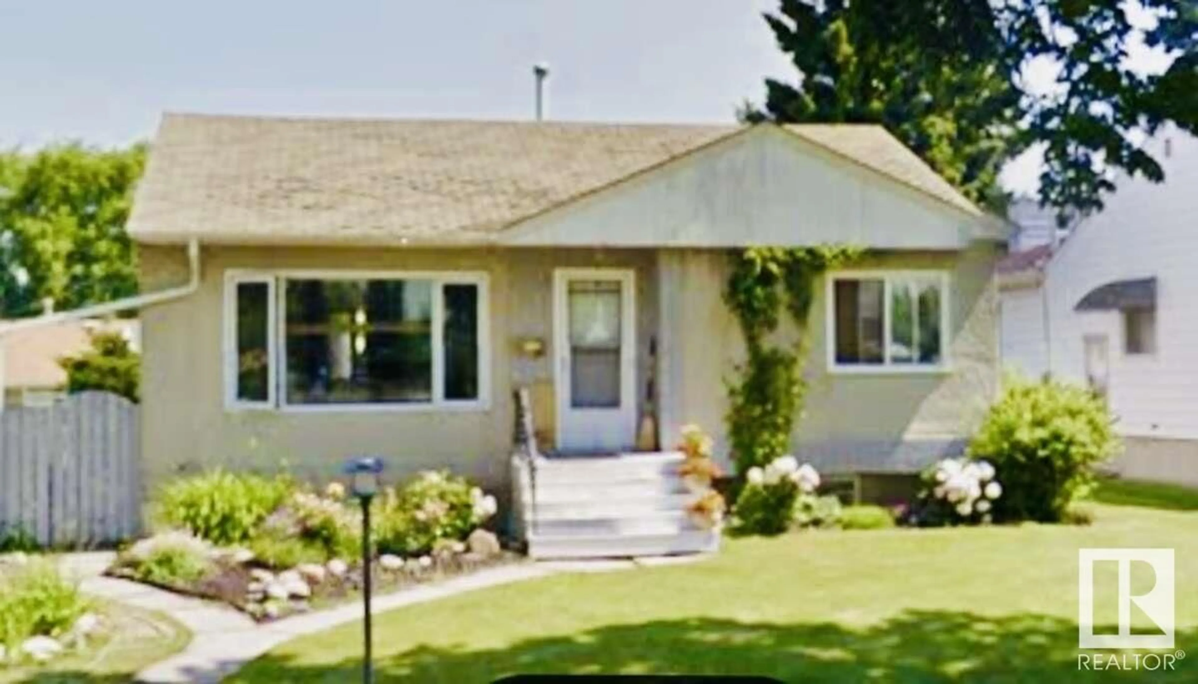 Home with vinyl exterior material, street for NW - 11619 137 ST, Edmonton Alberta T5M1N8