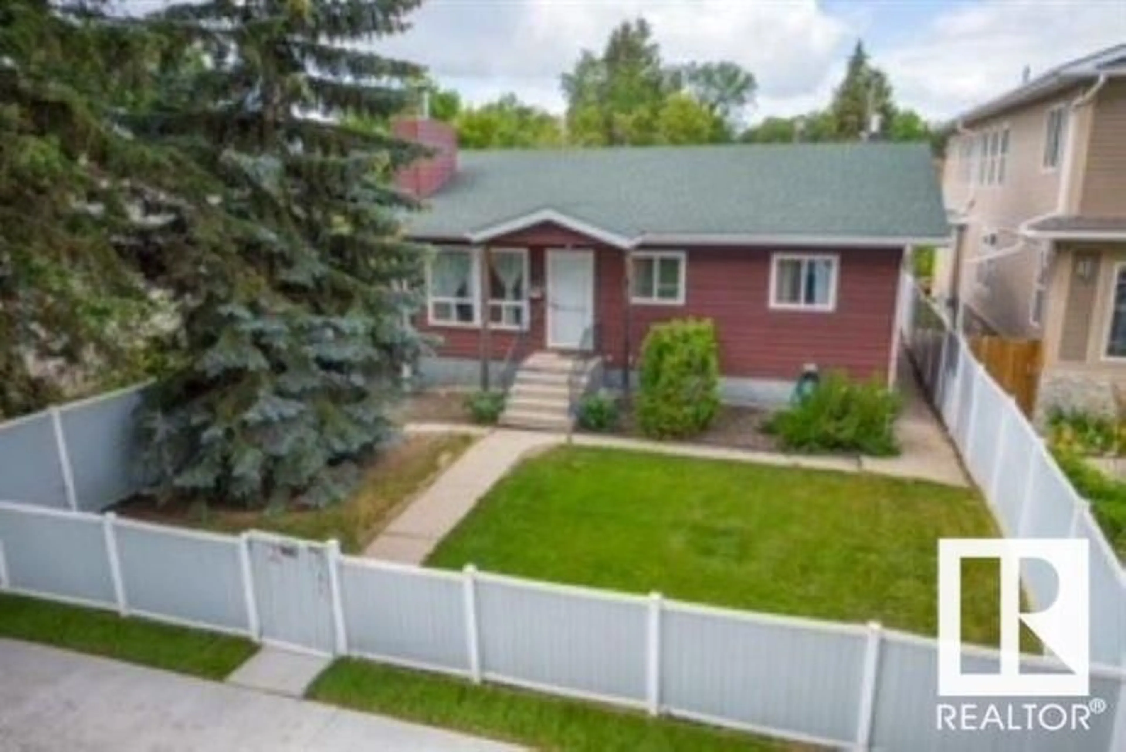 Home with vinyl exterior material, street for 12724 117 ST, Edmonton Alberta T5E5J5