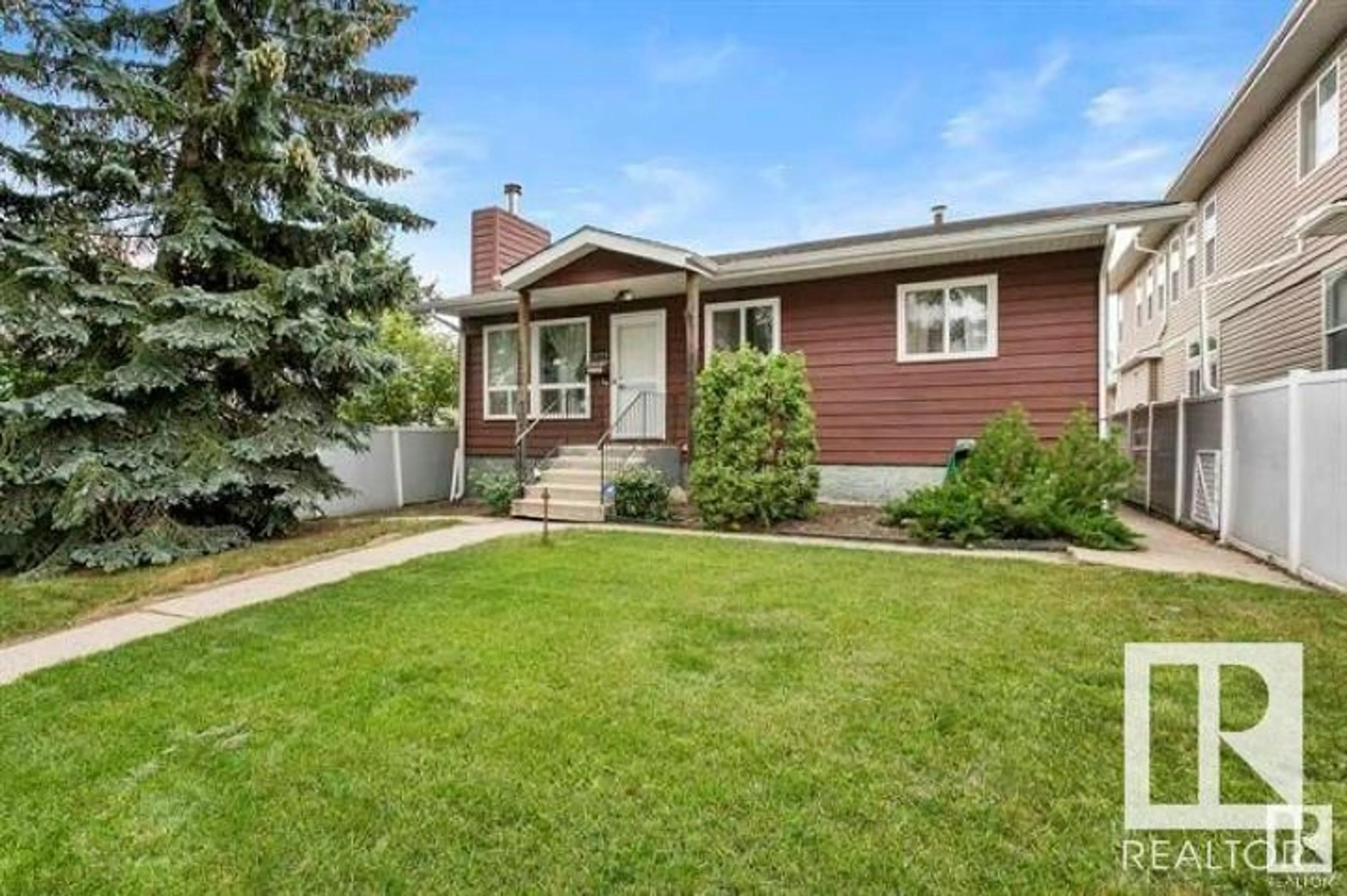 Home with vinyl exterior material, street for 12724 117 ST, Edmonton Alberta T5E5J5