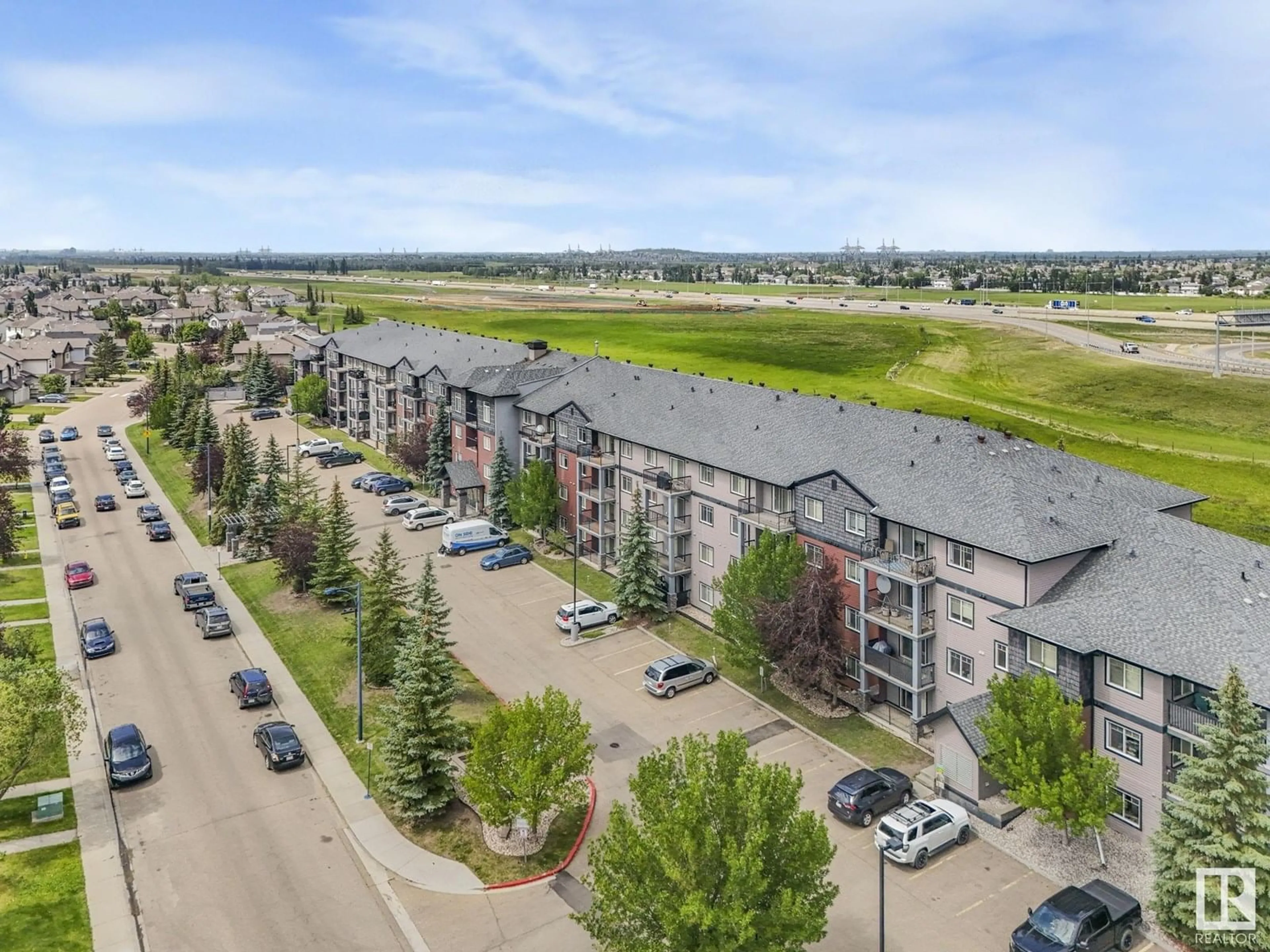 A pic from outside/outdoor area/front of a property/back of a property/a pic from drone, unknown for #209 - 646 MCALLISTER LO, Edmonton Alberta T6W0B5