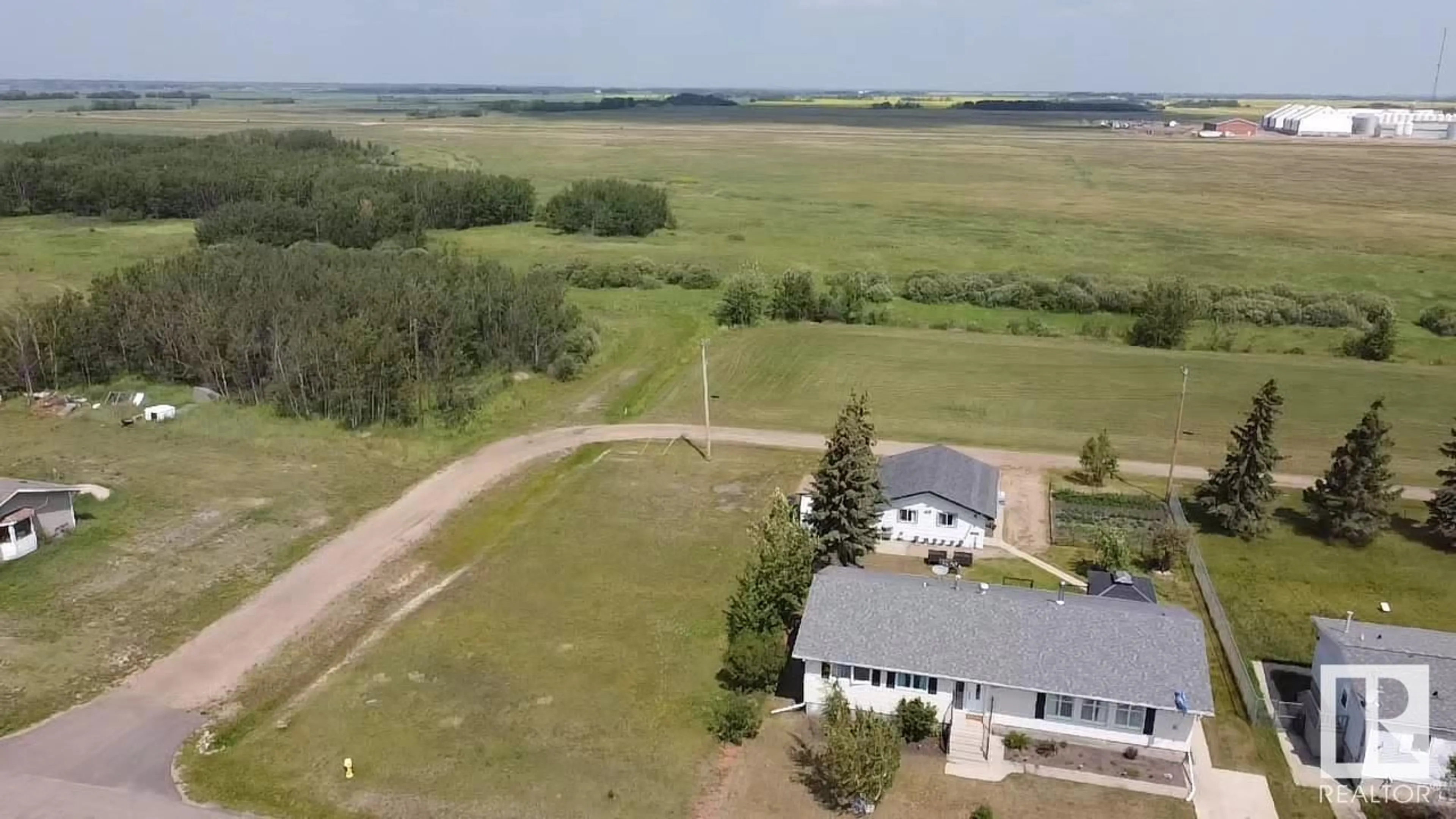 A pic from outside/outdoor area/front of a property/back of a property/a pic from drone, water/lake/river/ocean view for 5210 54 AV, Andrew Alberta T0C0C0